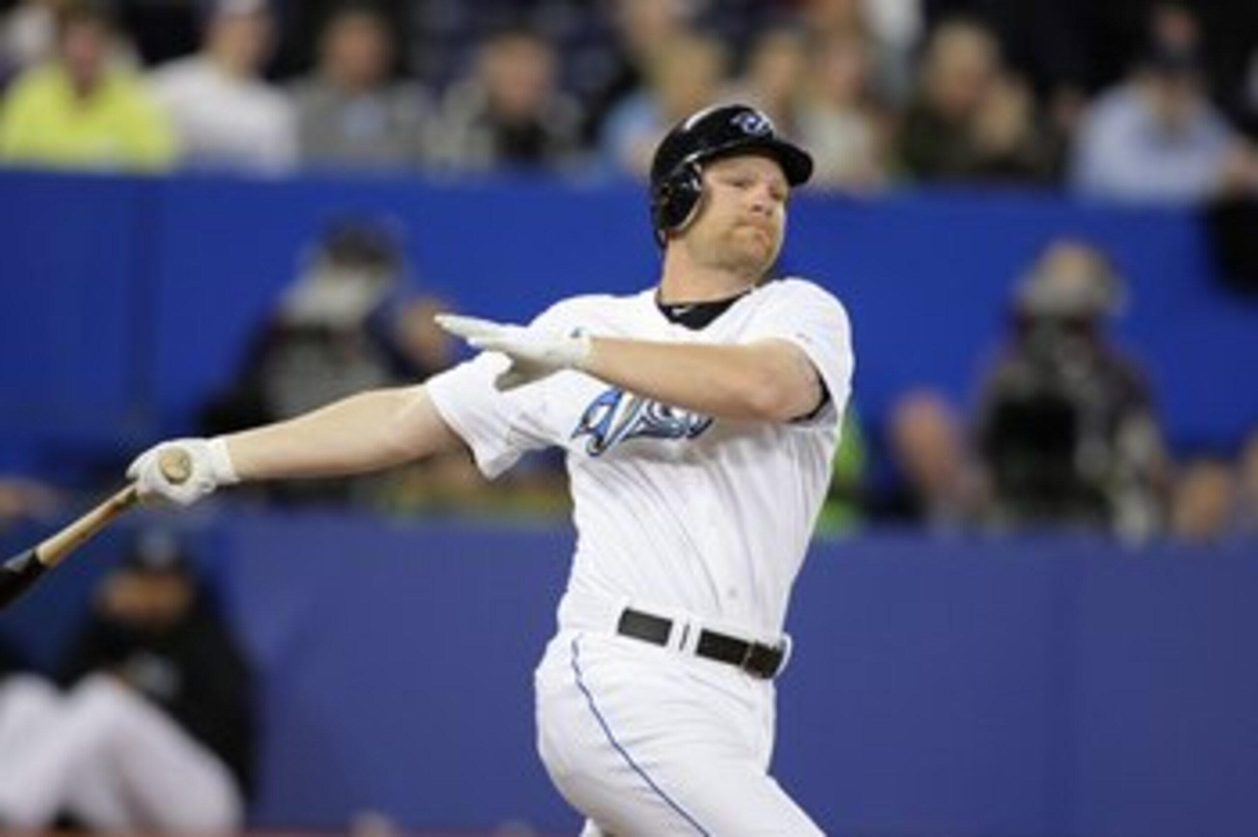 TORONTO - APRIL 12:  Adam Lind #26 of the Toronto Blue Jays swings at the pitch against the Chicago White Sox during their MLB game at the Rogers Centre April 12, 2010 in Toronto, Ontario.(Photo By Dave Sandford/Getty Images)