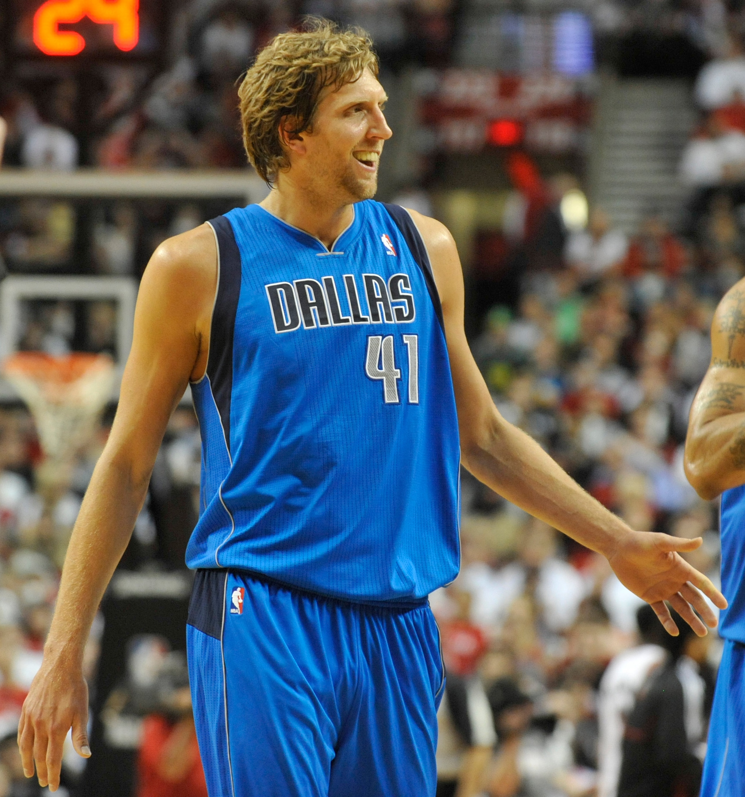 PORTLAND, OR - APRIL 28: Dirk Nowitski #41 of the Dallas Mavericks smiles as he heads to the bench during the fourth quarter of Game Six of the Western Conference Quartefinals against the Portland Trail Blazers in the 2011 NBA Playsoffs on April 28, 2011 
