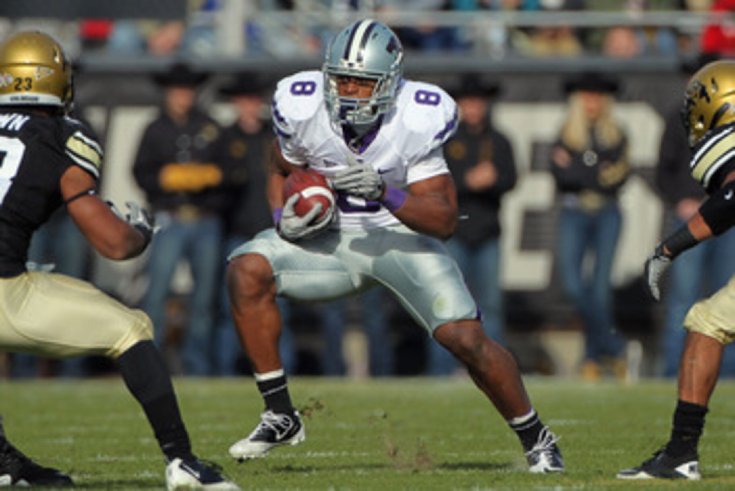 BOULDER, CO - NOVEMBER 20: Daniel Thomas #8 of the Kansas State Wildcats rushes with the ball against the Colorado Buffaloes at Folsom Field on November 20, 2010 in Boulder, Colorado. Colorado defeated Kansas State 44-36. (Photo by Doug Pensinger/Getty BOULDER, CO - NOVEMBER 20: Daniel Thomas #8 of the Kansas State Wildcats rushes with the ball against the Colorado Buffaloes at Folsom Field on November 20, 2010 in Boulder, Colorado. Colorado defeated Kansas State 44-36. (Photo by Doug Pensinger/Getty