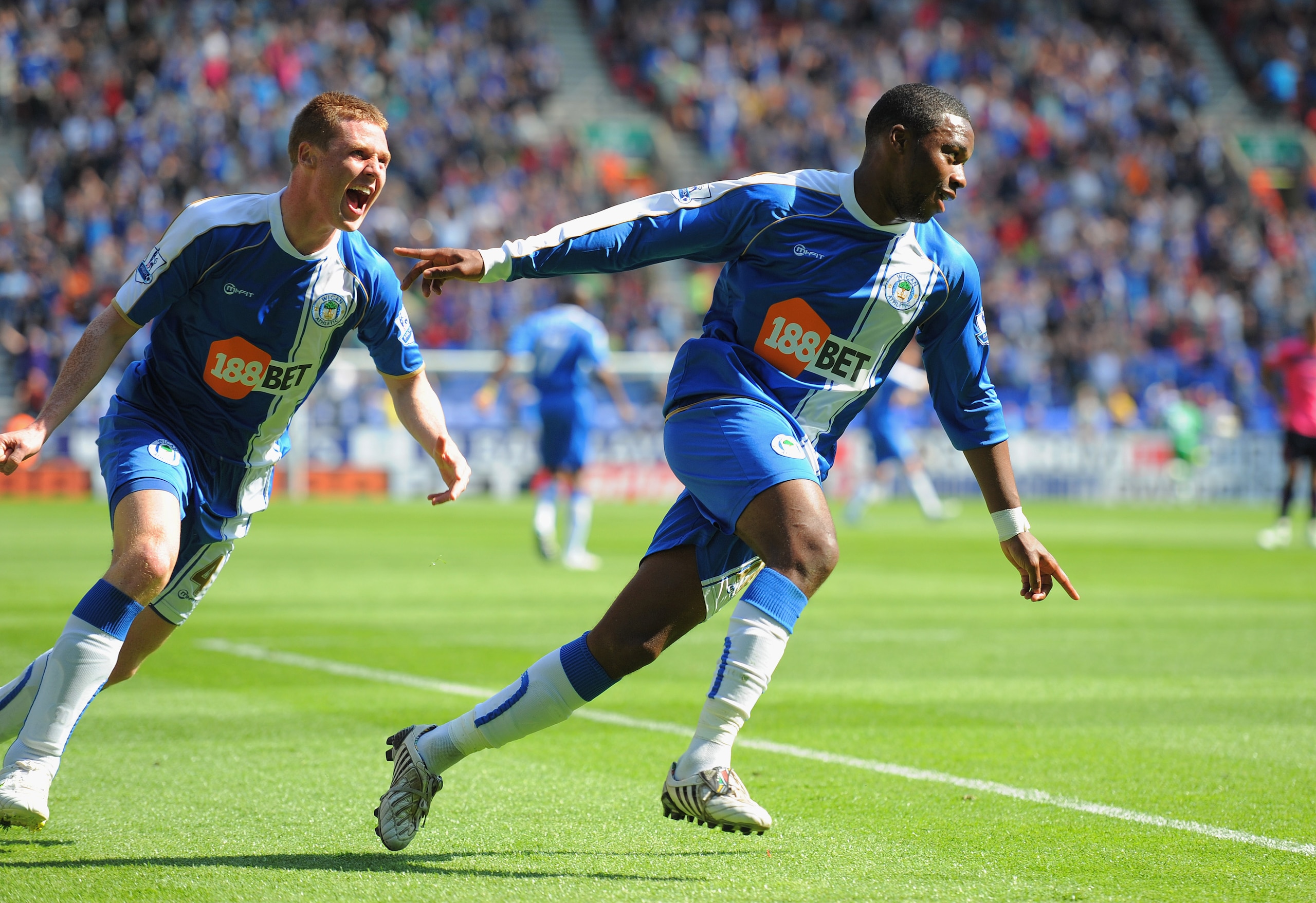 WIGAN, ENGLAND - APRIL 30: Charles N'Zogbia of Wigan celebrates scoring to make it 1-0 with team mate James McCarthy during the Barclays Premier League match between Wigan and Everton at the DW Stadium on April 30, 2011 in Wigan, England.  (Photo by Micha