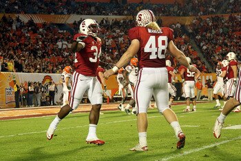 MIAMI, FL - JANUARY 03:  (L-R) Jeremy Stewart #34 and Owen Marecic #48 of the Stanford Cardinal celebrate after Stewart scored a 60-yard rushing touchdown in the first quarter against the Virginai Tech Hokies during the 2011 Discover Orange Bowl at Sun Li