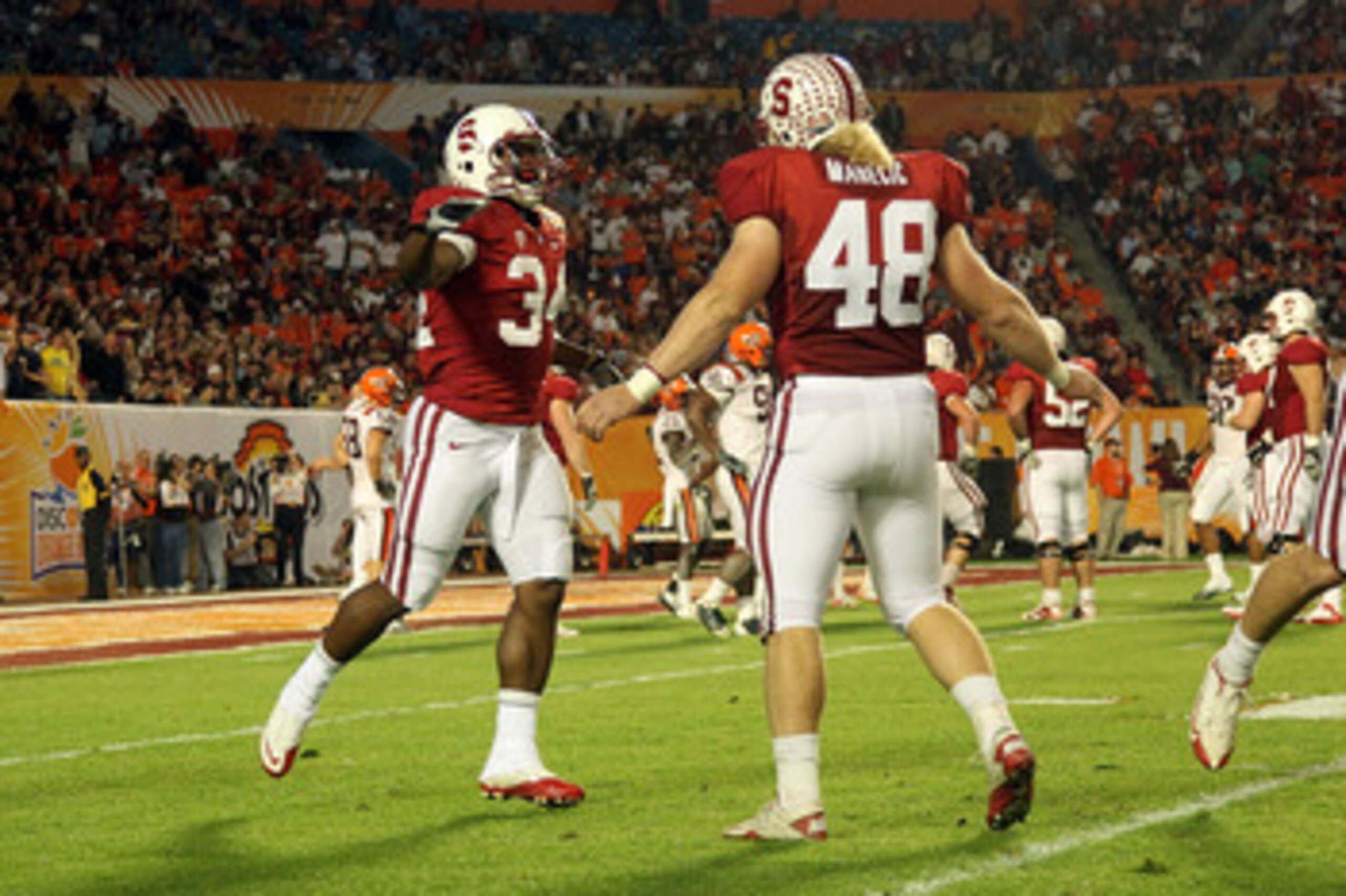 MIAMI, FL - JANUARY 03:  (L-R) Jeremy Stewart #34 and Owen Marecic #48 of the Stanford Cardinal celebrate after Stewart scored a 60-yard rushing touchdown in the first quarter against the Virginai Tech Hokies during the 2011 Discover Orange Bowl at Sun Li
