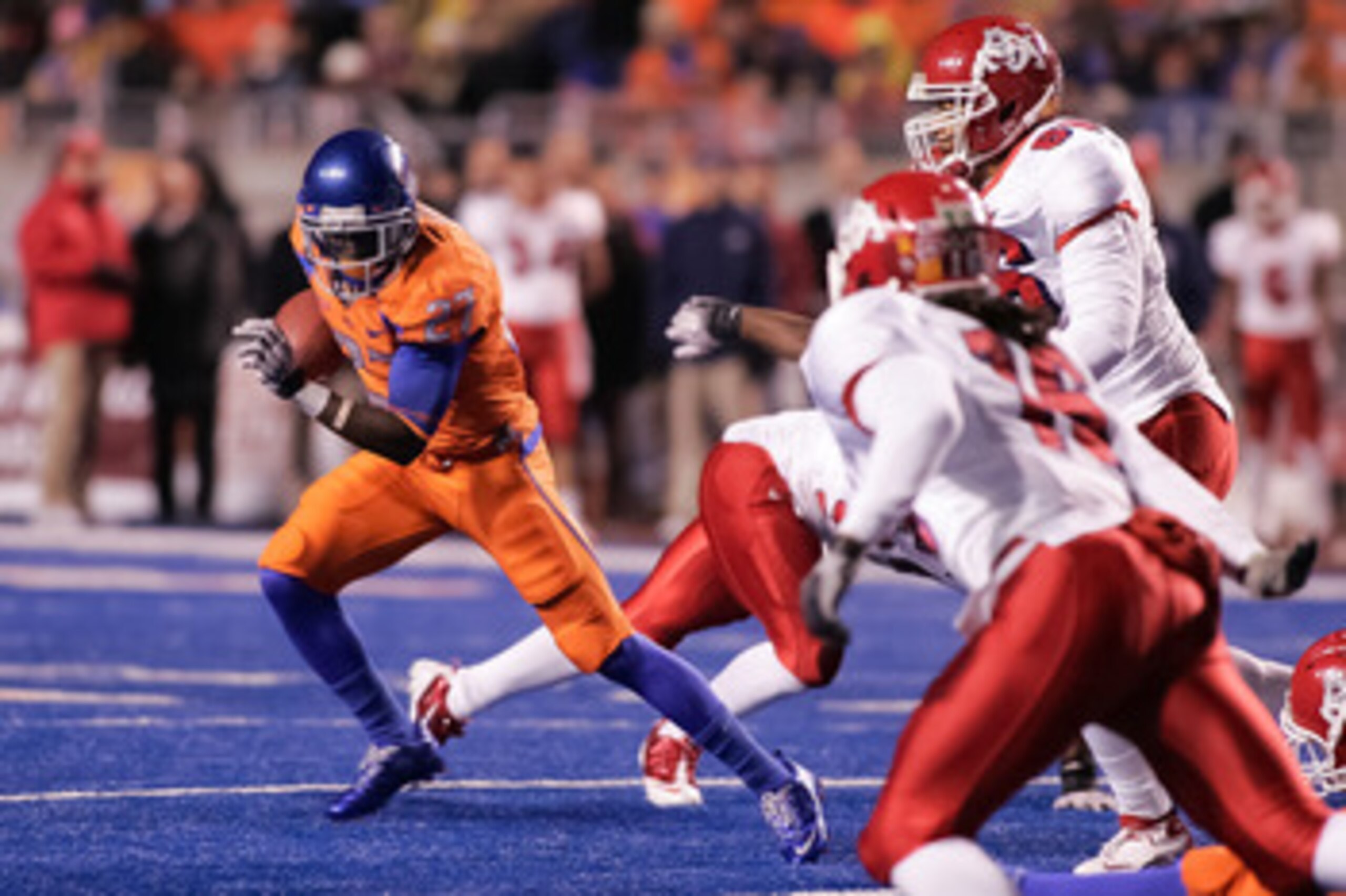 BOISE, ID - NOVEMBER 19:  Jeremy Avery #27 of the Boise State Broncos runs the ball against the Fresno State Bulldogs at Bronco Stadium on November 19, 2010 in Boise, Idaho.  (Photo by Otto Kitsinger III/Getty Images)