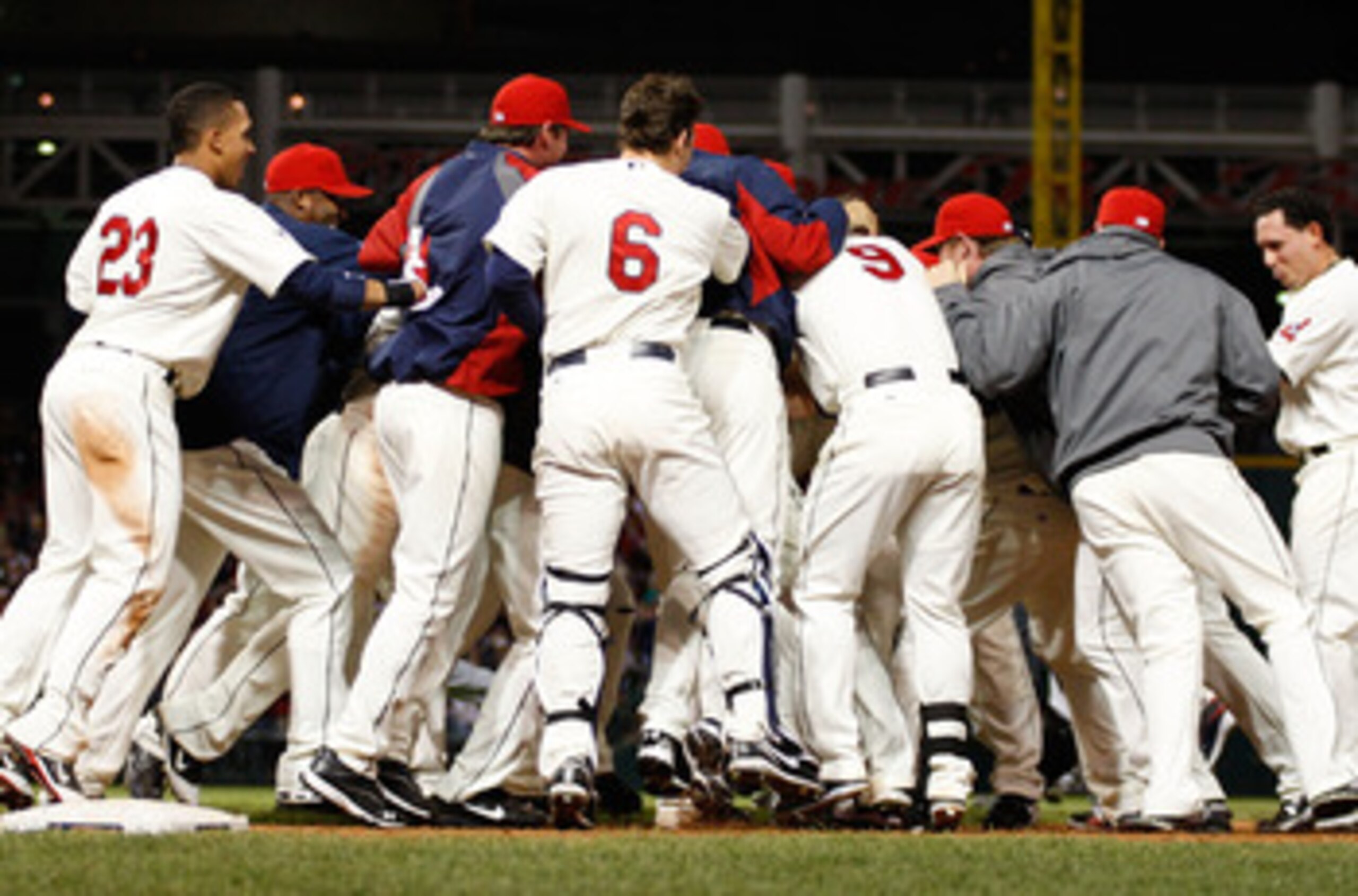 CLEVELAND - APRIL 30:  Members of the Cleveland Indians mob their teammate Orlando Cabrera after he hit a walk-off game winning single in the 13th inning against the Detroit Tigers during the game on April 30, 2011 at Progressive Field in Cleveland, Ohio.