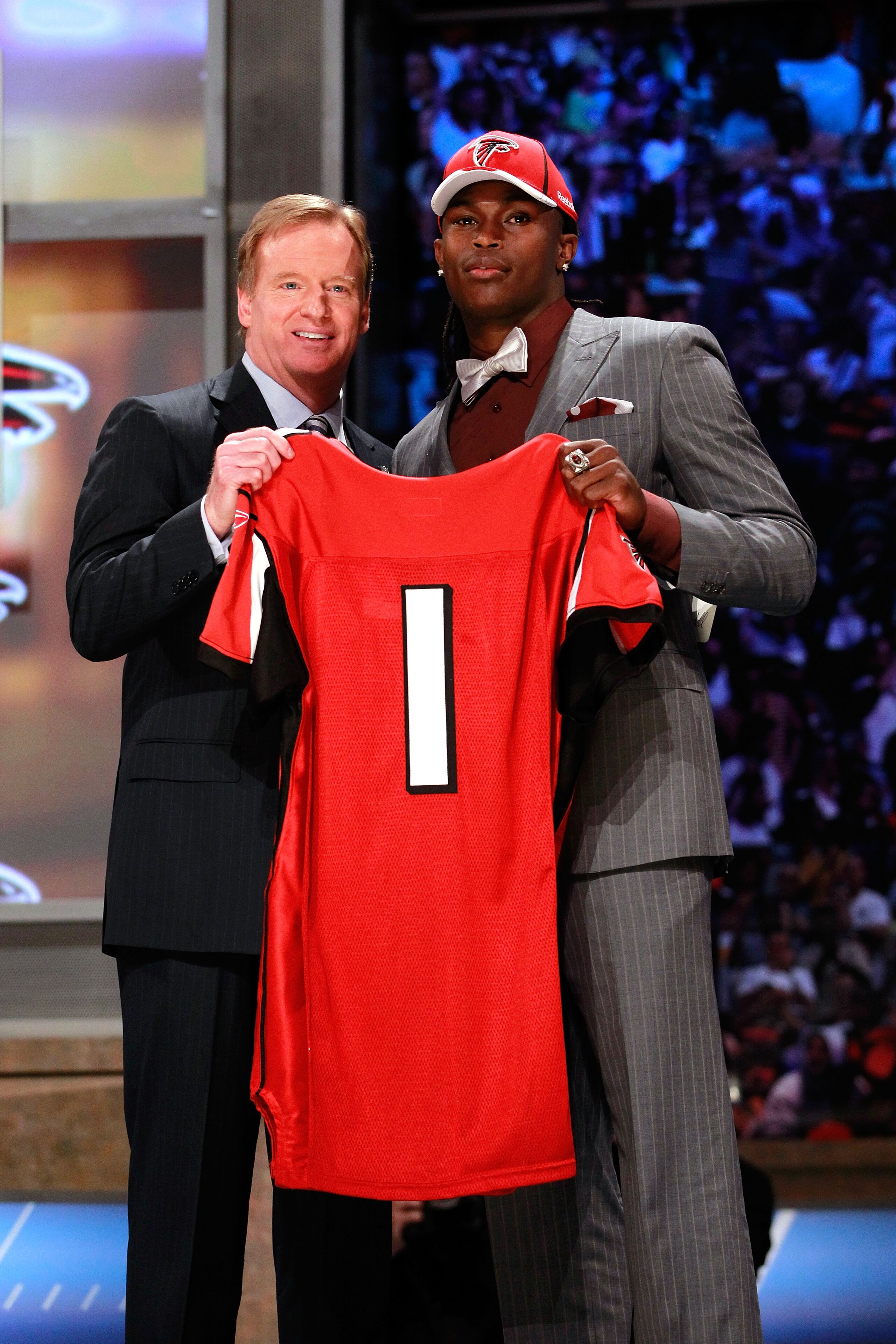 NEW YORK, NY - APRIL 28: NFL Commissioner Roger Goodell (L) poses for a photo with Julio Jones, #6 overall pick by the Atlanta Falcons, holds up a jersey on stage during the 2011 NFL Draft at Radio City Music Hall on April 28, 2011 in New York City. (Ph NEW YORK, NY - APRIL 28: NFL Commissioner Roger Goodell (L) poses for a photo with Julio Jones, #6 overall pick by the Atlanta Falcons, holds up a jersey on stage during the 2011 NFL Draft at Radio City Music Hall on April 28, 2011 in New York City. (Ph