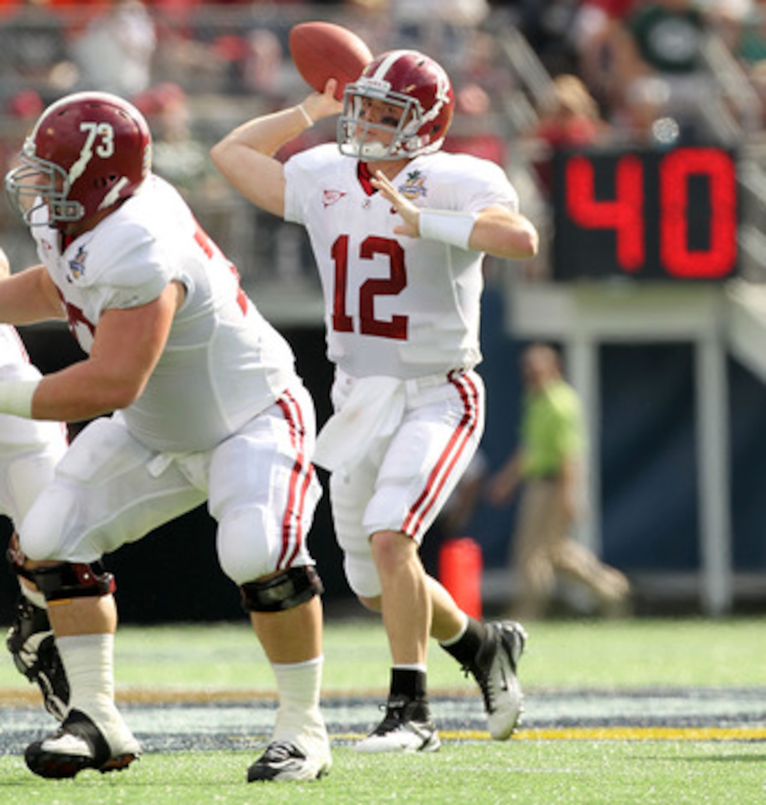 ORLANDO, FL - JANUARY 01:  Greg McElroy #12 of the Alabama Crimson Tide passes the ball during the Capitol One Bowl against the Michigan State Spartans at the Florida Citrus Bowl on January 1, 2011 in Orlando, Florida.  (Photo by Mike Ehrmann/Getty Images