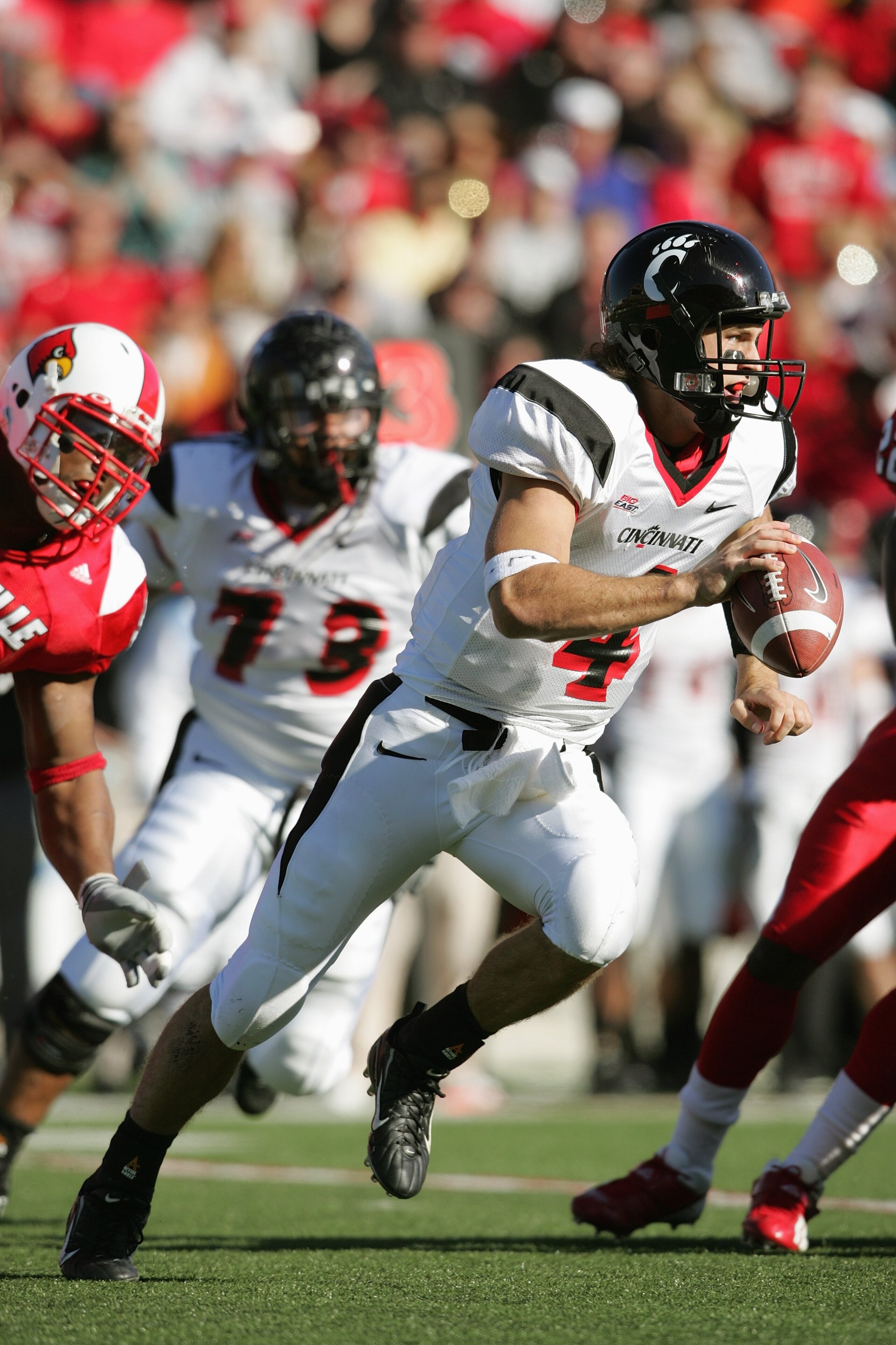 LOUISVILLE, KY - OCTOBER 14:  Quarterback Dustin Grutza #4 of the Cincinnati Bearcats scrambles during the game against the Louisville Cardinals on October 14, 2006 at Papa John's Cardinal Stadium in Louisville, Kentucky. Louisville defeated Cincinnati 23