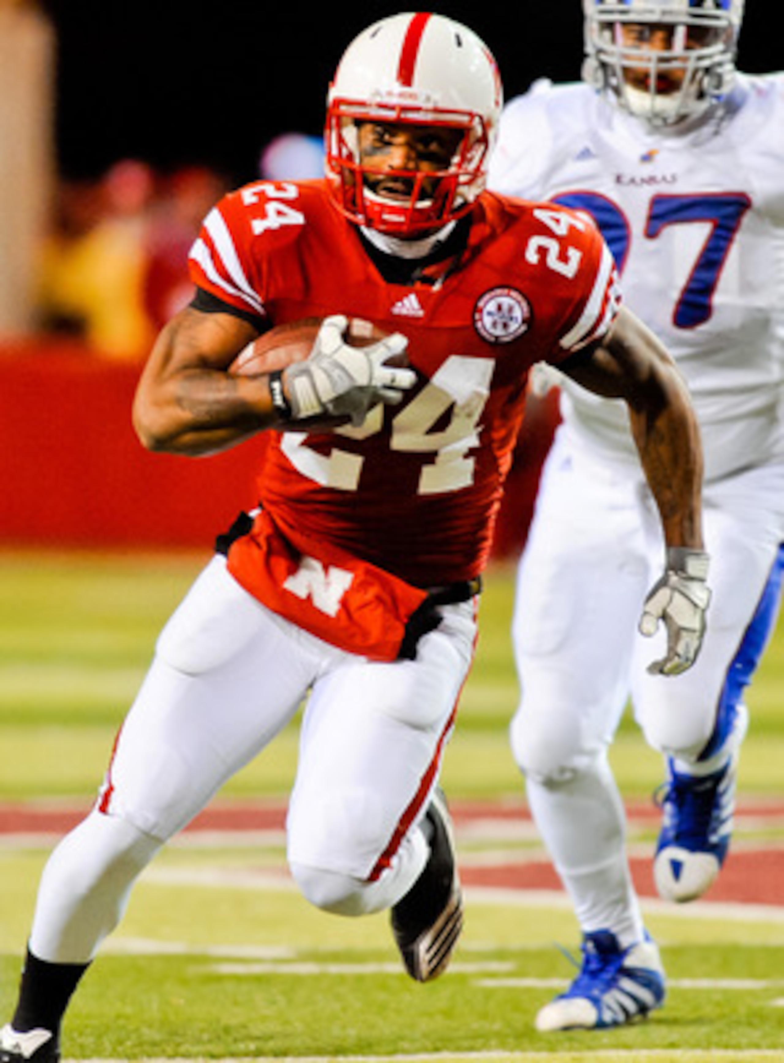 LINCOLN, NE - NOVEMBER 13: Niles Paul #24 of the Nebraska Cornhuskers finishes off a reception against the Kansas Jayhawks during their game at Memorial Stadium on November 13, 2010 in Lincoln, Nebraska. Nebraska Defeated Kansas 20-3. (Photo by Eric Franc