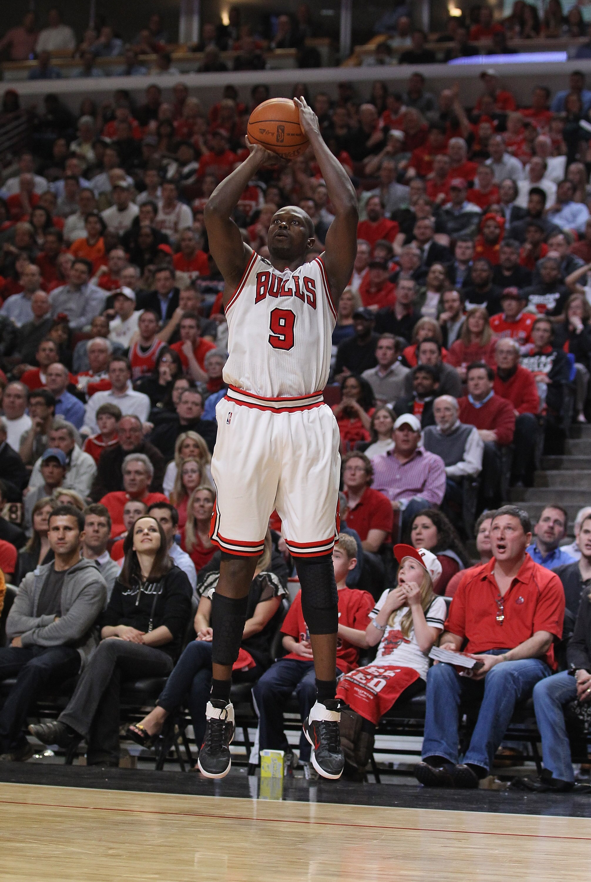CHICAGO, IL - APRIL 26: Loul Deng #9 of the Chicago Bulls shoot a three-point shot against the Indiana Pacers in Game Five of the Eastern Conference Quarterfinals in the 2011 NBA Playoffs at the United Center on April 26, 2011 in Chicago, Illinois. The Bu CHICAGO, IL - APRIL 26: Loul Deng #9 of the Chicago Bulls shoot a three-point shot against the Indiana Pacers in Game Five of the Eastern Conference Quarterfinals in the 2011 NBA Playoffs at the United Center on April 26, 2011 in Chicago, Illinois. The Bu