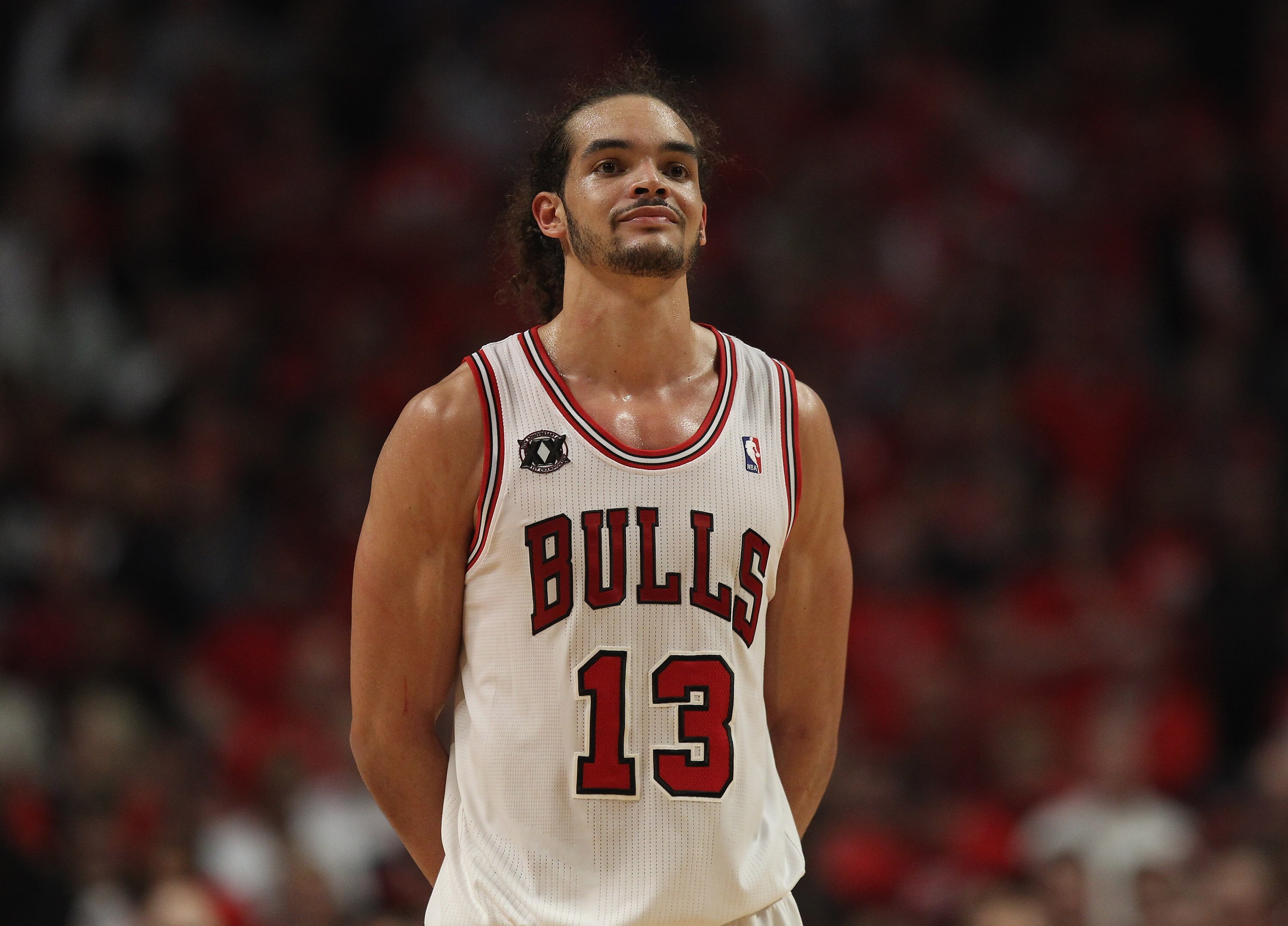 CHICAGO, IL - APRIL 26: Joakim Noah #13 of the Chicago Bulls smiles at family in the stands near the end of a win over the Indiana Pacers in Game Five of the Eastern Conference Quarterfinals in the 2011 NBA Playoffs at the United Center on April 26, 2011 CHICAGO, IL - APRIL 26: Joakim Noah #13 of the Chicago Bulls smiles at family in the stands near the end of a win over the Indiana Pacers in Game Five of the Eastern Conference Quarterfinals in the 2011 NBA Playoffs at the United Center on April 26, 2011