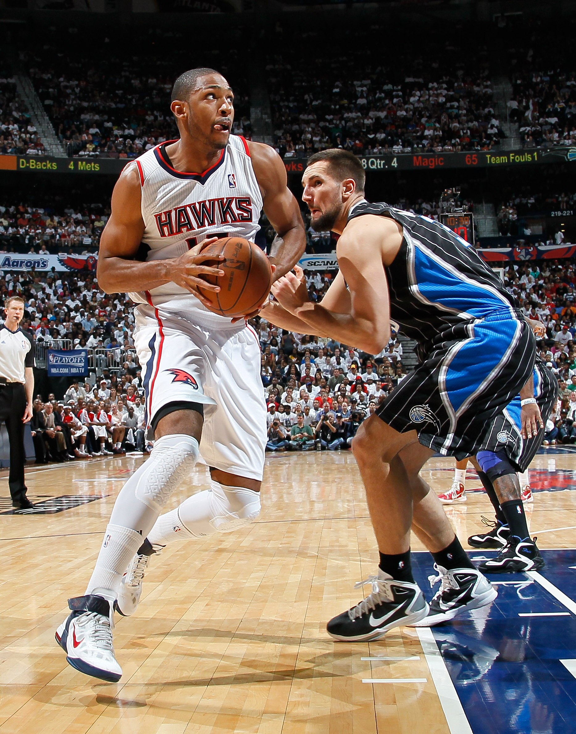 ATLANTA, GA - APRIL 24: Al Horford #15 of the Atlanta Hawks drives around Ryan Anderson #33 of the Orlando Magic during Game Four of the Eastern Conference Quarterfinals in the 2011 NBA Playoffs at Philips Arena on April 24, 2011 in Atlanta, Georgia. NO ATLANTA, GA - APRIL 24: Al Horford #15 of the Atlanta Hawks drives around Ryan Anderson #33 of the Orlando Magic during Game Four of the Eastern Conference Quarterfinals in the 2011 NBA Playoffs at Philips Arena on April 24, 2011 in Atlanta, Georgia. NO