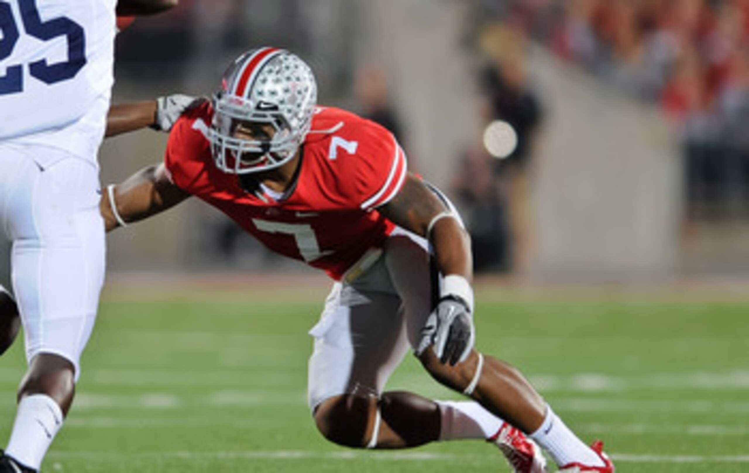 COLUMBUS, OH - NOVEMBER 13:  Jermale Hines #7 of the Ohio State Buckeyes tackles Silas Redd #25 of the Penn State Nittany Lions at Ohio Stadium on November 13, 2010 in Columbus, Ohio.  (Photo by Jamie Sabau/Getty Images)