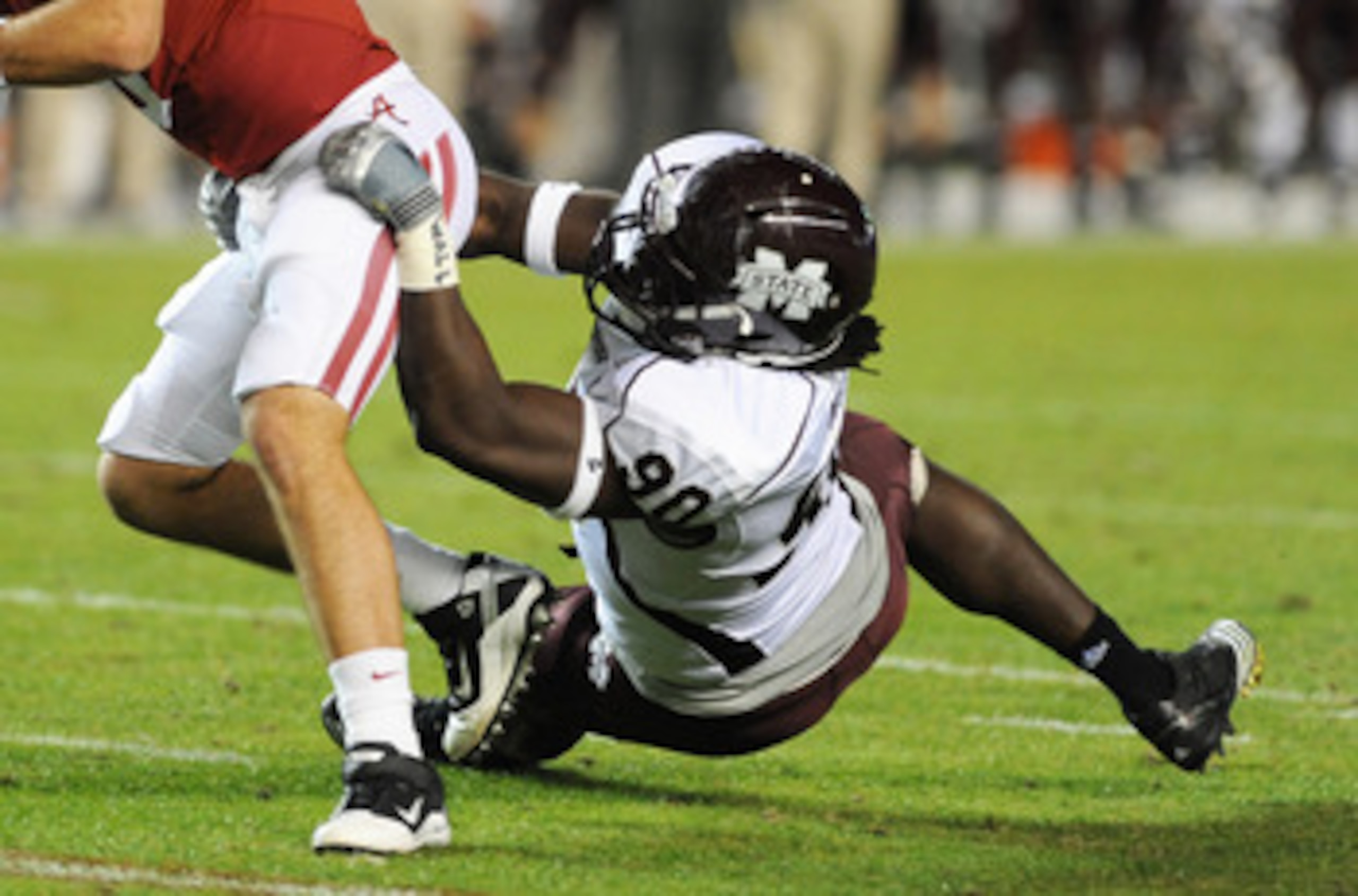 TUSCALOOSA, AL - NOVEMBER 13: Defensive lineman Pernell McPhee #90 of the Mississippi State Bulldogs sacks quarterback A. J. McCarron #10 of the Alabama Crimson Tide November 13, 2010 at Bryant-Denny Stadium in Tuscaloosa, Alabama.  (Photo by Al Messersch