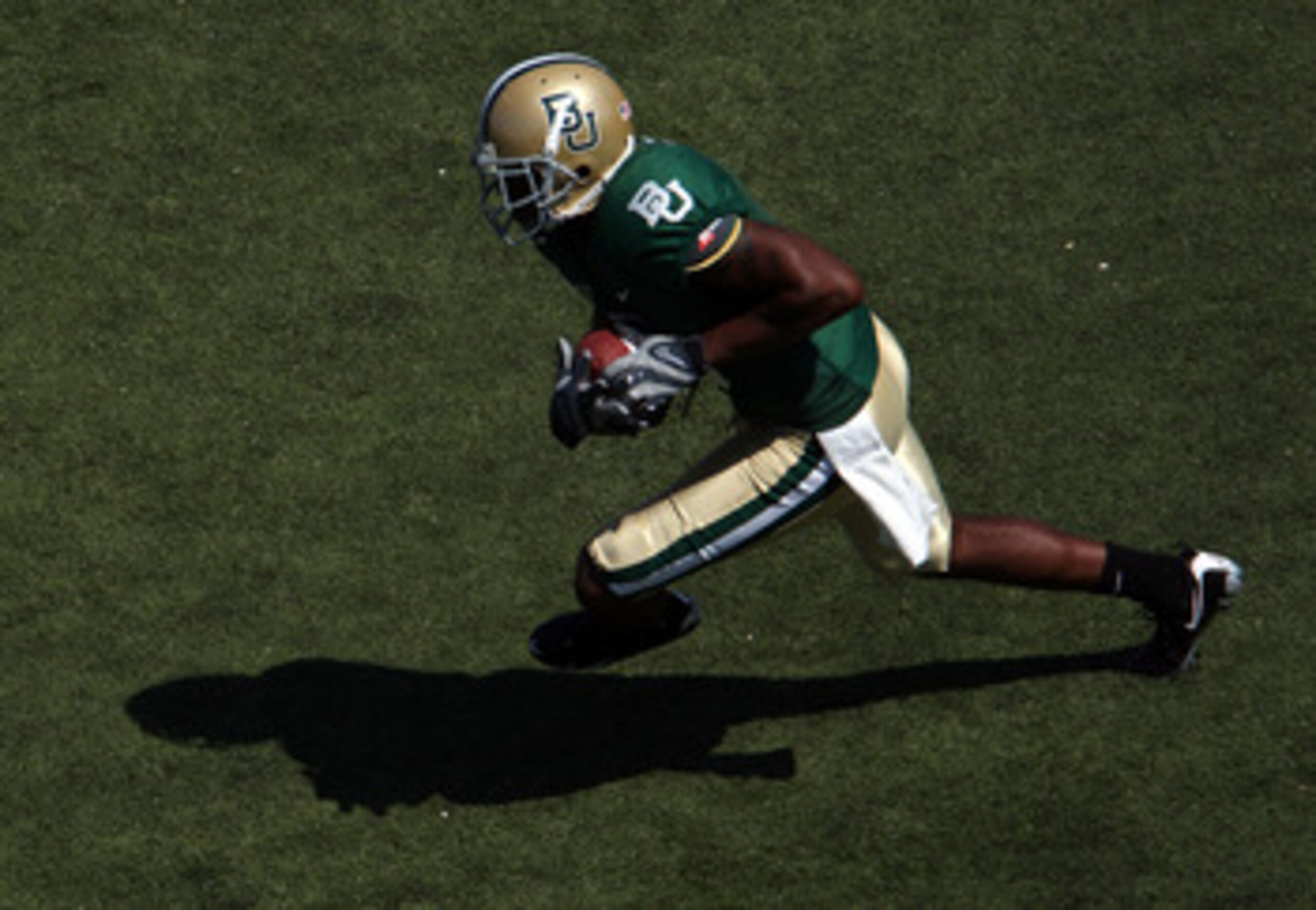 WACO, TX - OCTOBER 04:  Mikail Baker #5 of the Baylor Bears runs the ball against the Oklahoma Sooners at Floyd Casey Stadium on October 4, 2008 in Waco, Texas.  (Photo by Ronald Martinez/Getty Images)