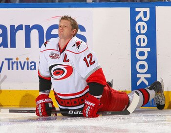 BUFFALO, NY - MARCH 15: Eric Staal #12 of the Carolina Hurricanes streches during warm ups prior to play against the Buffalo Sabres at HSBC Arena on March 15, 2011 in Buffalo, New York. Carolina won 1-0.  (Photo by Rick Stewart/Getty Images)