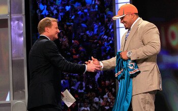 NEW YORK, NY - APRIL 28:  NFL Commissioner Roger Goodell (L) greets Mike Pouncey, #15 overall pick by the Miami Dolphins, on stage during the 2011 NFL Draft at Radio City Music Hall on April 28, 2011 in New York City.  (Photo by Chris Trotman/Getty Images