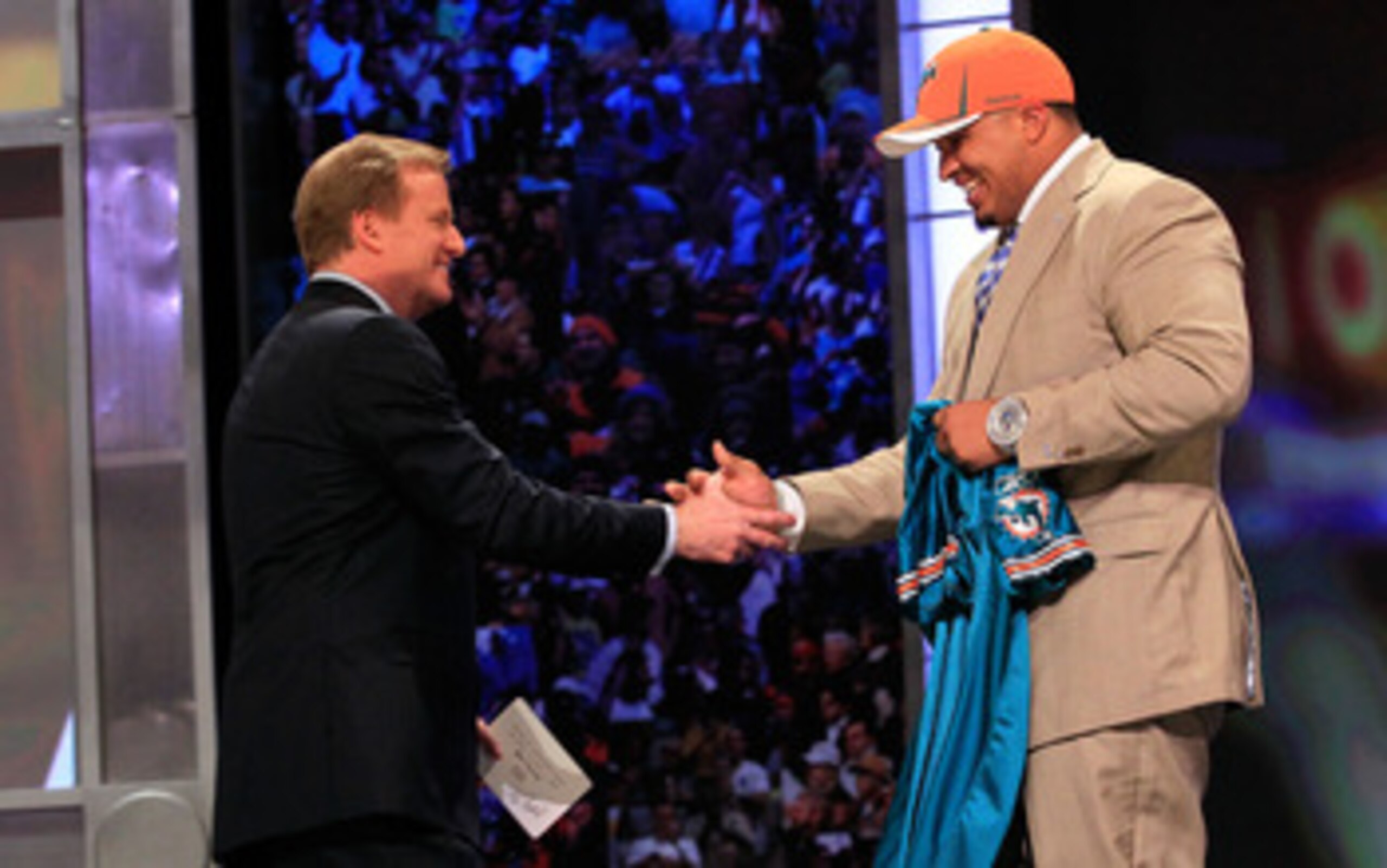 NEW YORK, NY - APRIL 28:  NFL Commissioner Roger Goodell (L) greets Mike Pouncey, #15 overall pick by the Miami Dolphins, on stage during the 2011 NFL Draft at Radio City Music Hall on April 28, 2011 in New York City.  (Photo by Chris Trotman/Getty Images