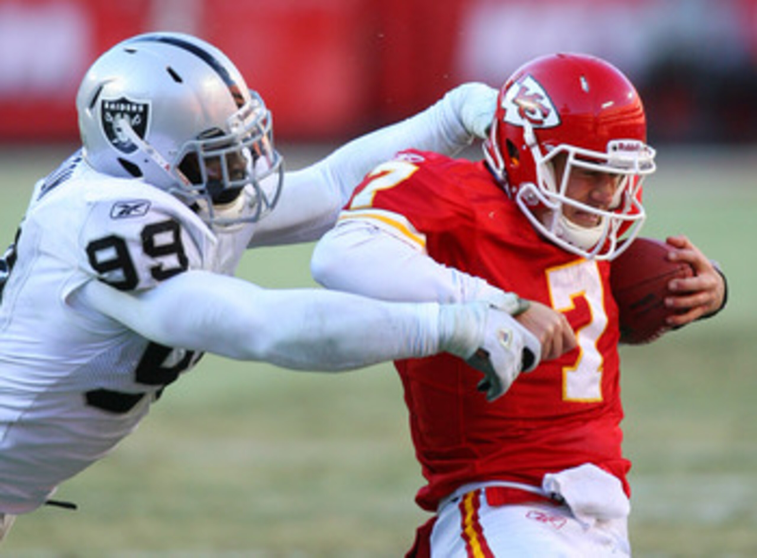 KANSAS CITY, MO - JANUARY 02: Quarterback Matt Cassel #7 of the Kansas City Chiefs is sacked by defensive end Lamarr Houston #99 of the Oakland Raiders in a game at Arrowhead Stadium on January 2, 2011 in Kansas City, Missouri. The Raiders won 31-10 (Ph KANSAS CITY, MO - JANUARY 02: Quarterback Matt Cassel #7 of the Kansas City Chiefs is sacked by defensive end Lamarr Houston #99 of the Oakland Raiders in a game at Arrowhead Stadium on January 2, 2011 in Kansas City, Missouri. The Raiders won 31-10 (Ph