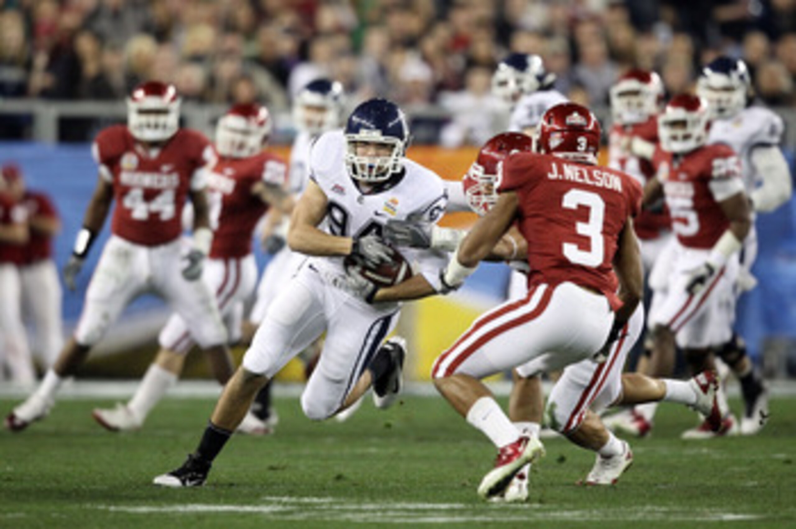 GLENDALE, AZ - JANUARY 01:  Ryan Griffin #94 of the Connecticut Huskies runs after a catch in the first half while taking on the Oklahoma Sooners during the Tostitos Fiesta Bowl at the Universtity of Phoenix Stadium on January 1, 2011 in Glendale, Arizona