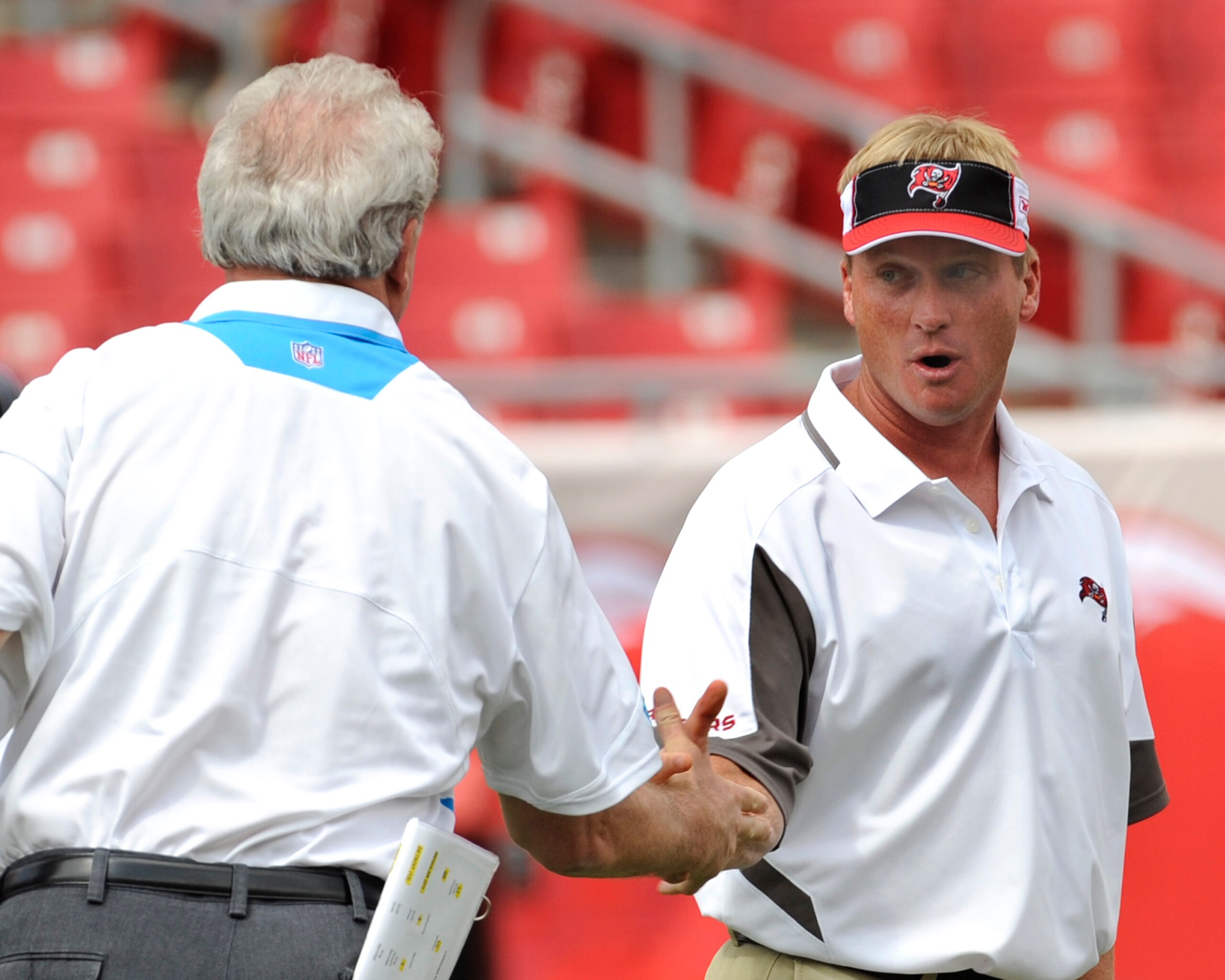 TAMPA, FL - OCTOBER 12: Coach Jon Gruden of the Tampa Bay Buccaneers shakes hands with coach John Fox of the Carolina Panthers at Raymond James Stadium on October 12, 2008 in Tampa, Florida. (Photo by Al Messerschmidt/Getty Images) TAMPA, FL - OCTOBER 12: Coach Jon Gruden of the Tampa Bay Buccaneers shakes hands with coach John Fox of the Carolina Panthers at Raymond James Stadium on October 12, 2008 in Tampa, Florida. (Photo by Al Messerschmidt/Getty Images)