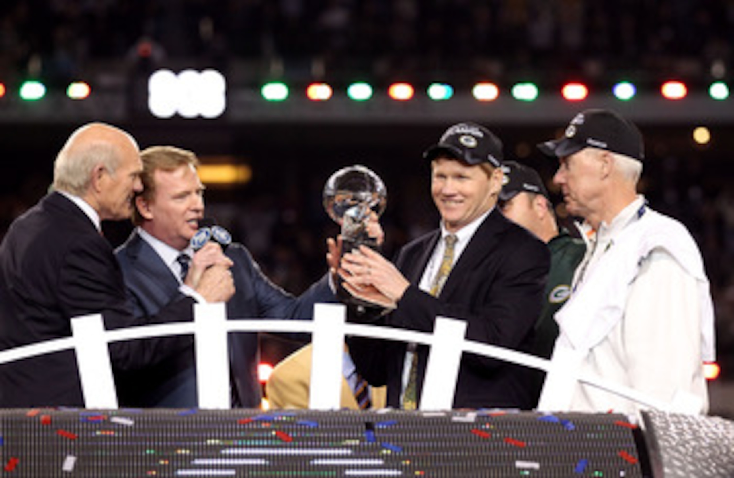 ARLINGTON, TX - FEBRUARY 06:  President and CEO of the Green Bay Packers Mark Murphy holds up the Vince Lombardi Trophy after winning Super Bowl XLV against the Pittsburgh Steelers 31-25 as Green Bay Packers General Manager Ted Thompson and NFL Commission