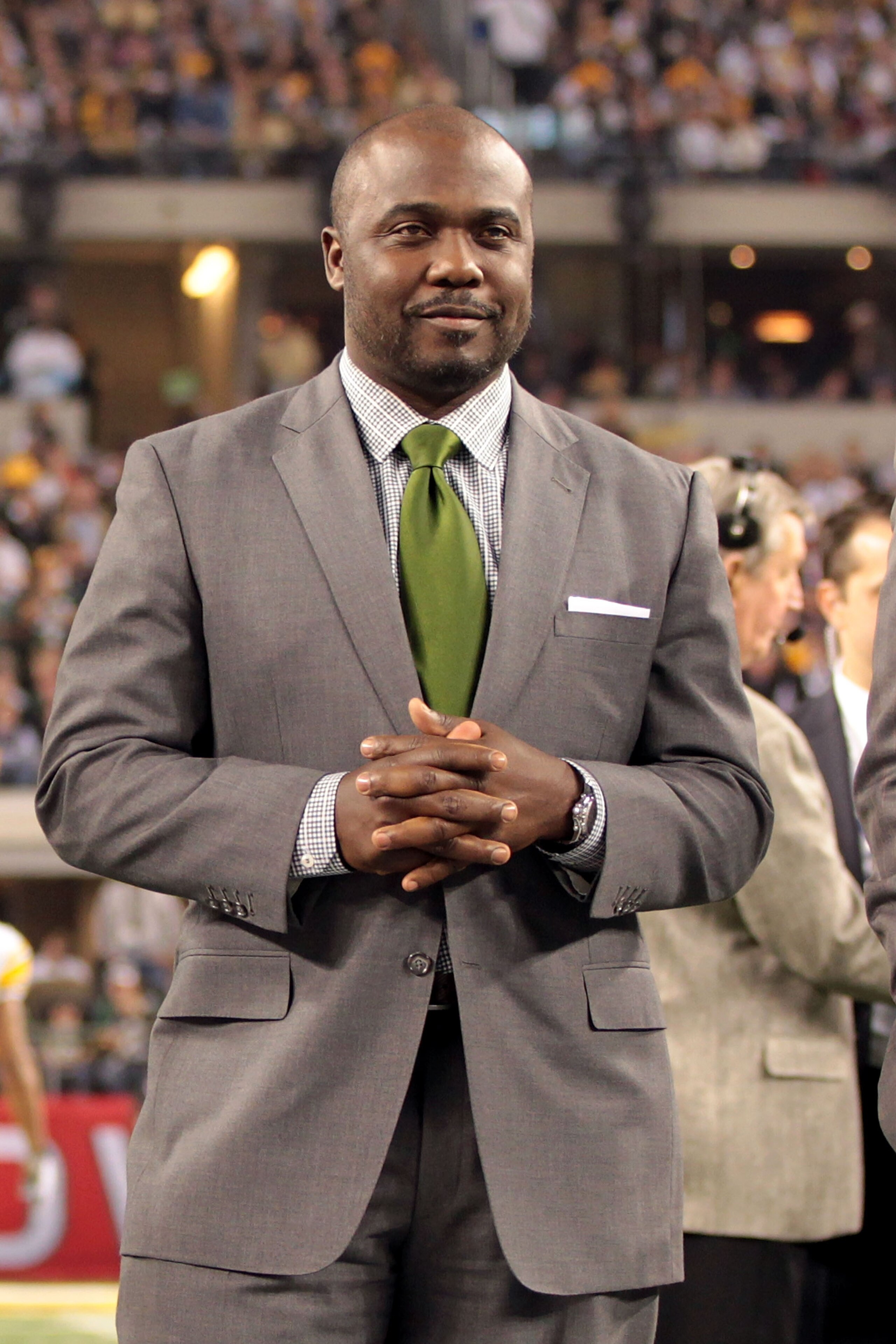 ARLINGTON, TX - FEBRUARY 06: Pro Football Hall of Fame Class of 2011 member Marshall Faulk stands on the field prior to Super Bowl XLV between the Pittsburgh Steelers and the Green Bay Packers at Cowboys Stadium on February 6, 2011 in Arlington, Texas. ARLINGTON, TX - FEBRUARY 06: Pro Football Hall of Fame Class of 2011 member Marshall Faulk stands on the field prior to Super Bowl XLV between the Pittsburgh Steelers and the Green Bay Packers at Cowboys Stadium on February 6, 2011 in Arlington, Texas.