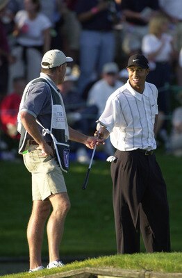 24 March 2001:  Tiger Woods laughs with caddie Steve Williams after making birdie on the 17th hole at the TPC at Sawgrass during the third round of play at The Players Championship in Ponte Vedra Beach, Florida.  DIGITAL IMAGE.  Mandatory Credit: Harry Ho
