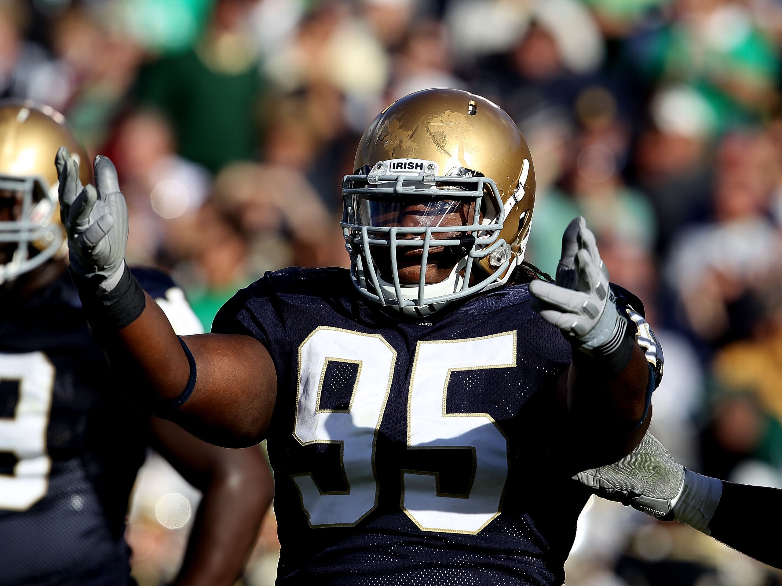 SOUTH BEND, IN - SEPTEMBER 04: Ian Williams #95 of the Notre Dame Fighting Irish encourages the crowd during a game against the Purdue Boilermakers at Notre Dame Stadium on September 4, 2010 in South Bend, Indiana. Notre Dame defeated Purdue 23-12. (Photo