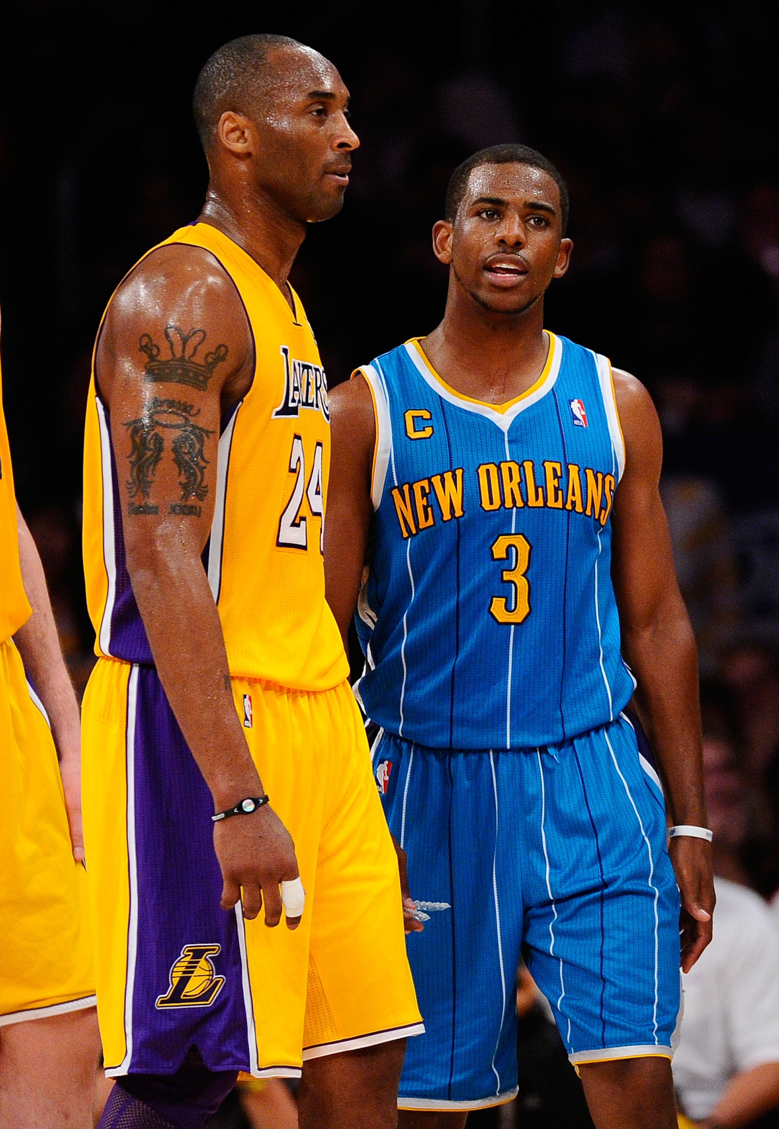 LOS ANGELES, CA - APRIL 20:  Kobe Bryant #24 of the Los Angeles Lakers stands next to Chris Paul #3 of the New Orleans Hornets in Game Two of the Western Conference Quarterfinals in the 2011 NBA Playoffs on April 20, 2011 at Staples Center in Los Angeles,