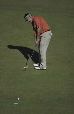 SANDWICH, ENGLAND - JULY 20:  Ben Curtis of the USA putts on the 18th green to finish one under during the final round of the Open Championship at the Royal St. George's course on July 20, 2003 in Sandwich, England. (Photo by Ross Kinnaird/Getty Images)