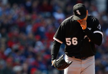 CLEVELAND - APRIL 01:  Mark Buehrle #56 of the Chicago White Sox warms his hands during the Opening Day game against the Cleveland Indians on April 1, 2011 at Progressive Field in Cleveland, Ohio. The high temperature in Cleveland only reached 44 degrees.
