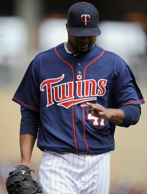 MINNEAPOLIS, MN - APRIL 13: Francisco Liriano #47 of the Minnesota Twins looks as his hand as he walks to the Twins' dugout during their game against the Kansas City Royals on April 13, 2011 at Target Field in Minneapolis, Minnesota. Royals defeated the T