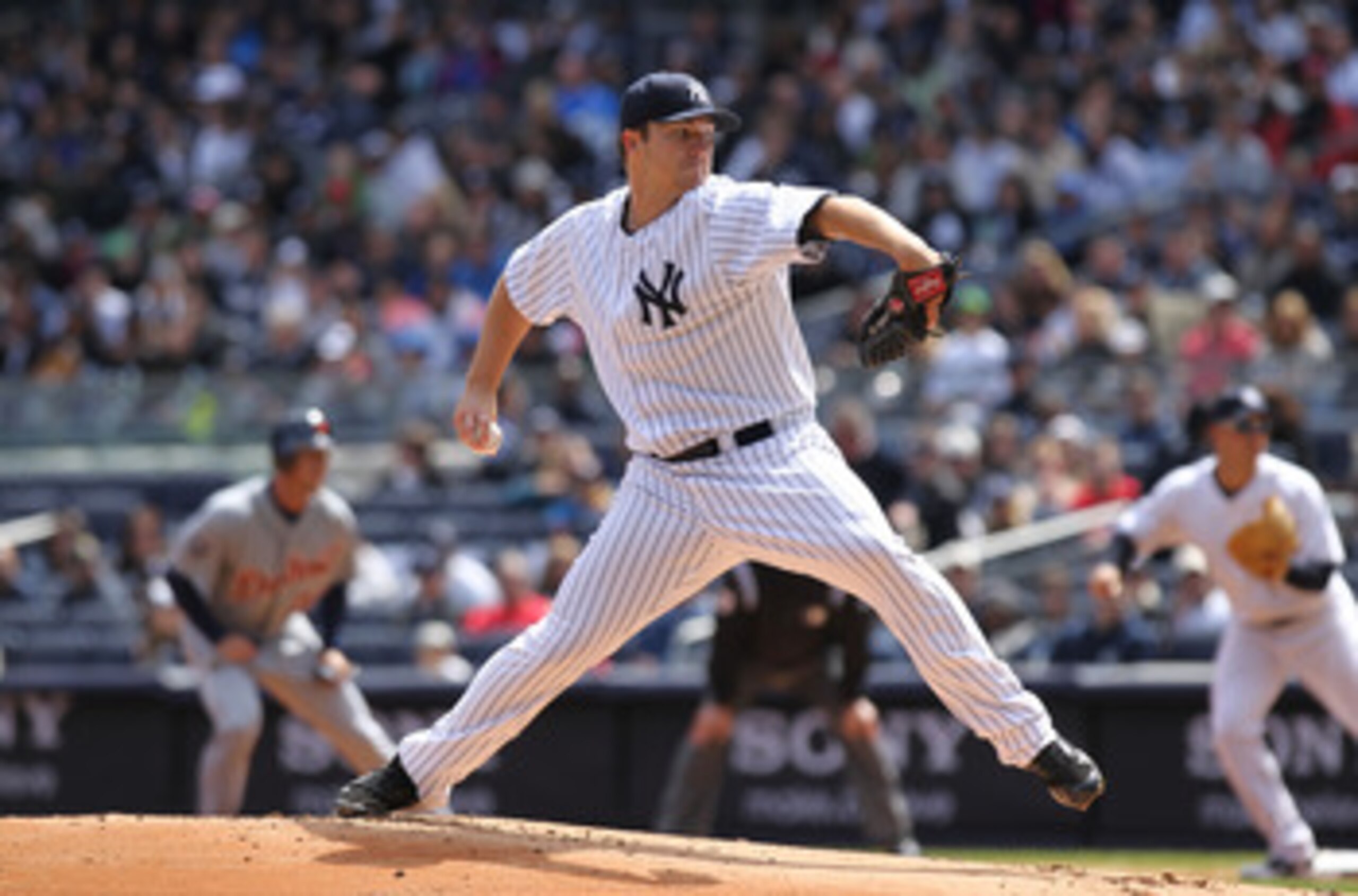 NEW YORK, NY - APRIL 03:  Phil Hughes #65 of the New York Yankees pitches against the Detroit Tigers at Yankee Stadium on April 3, 2011 in the Bronx borough of New York City.  (Photo by Nick Laham/Getty Images)
