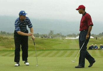 GEORGE, SOUTH AFRICA - NOVEMBER 23:  International Team member Ernie Els of South Africa reacts to Tiger Woods on the 9th hole after half on the hole on his way to a 4 and 3 loss during the final round of the President's Cup at The Links at Fancourt on No