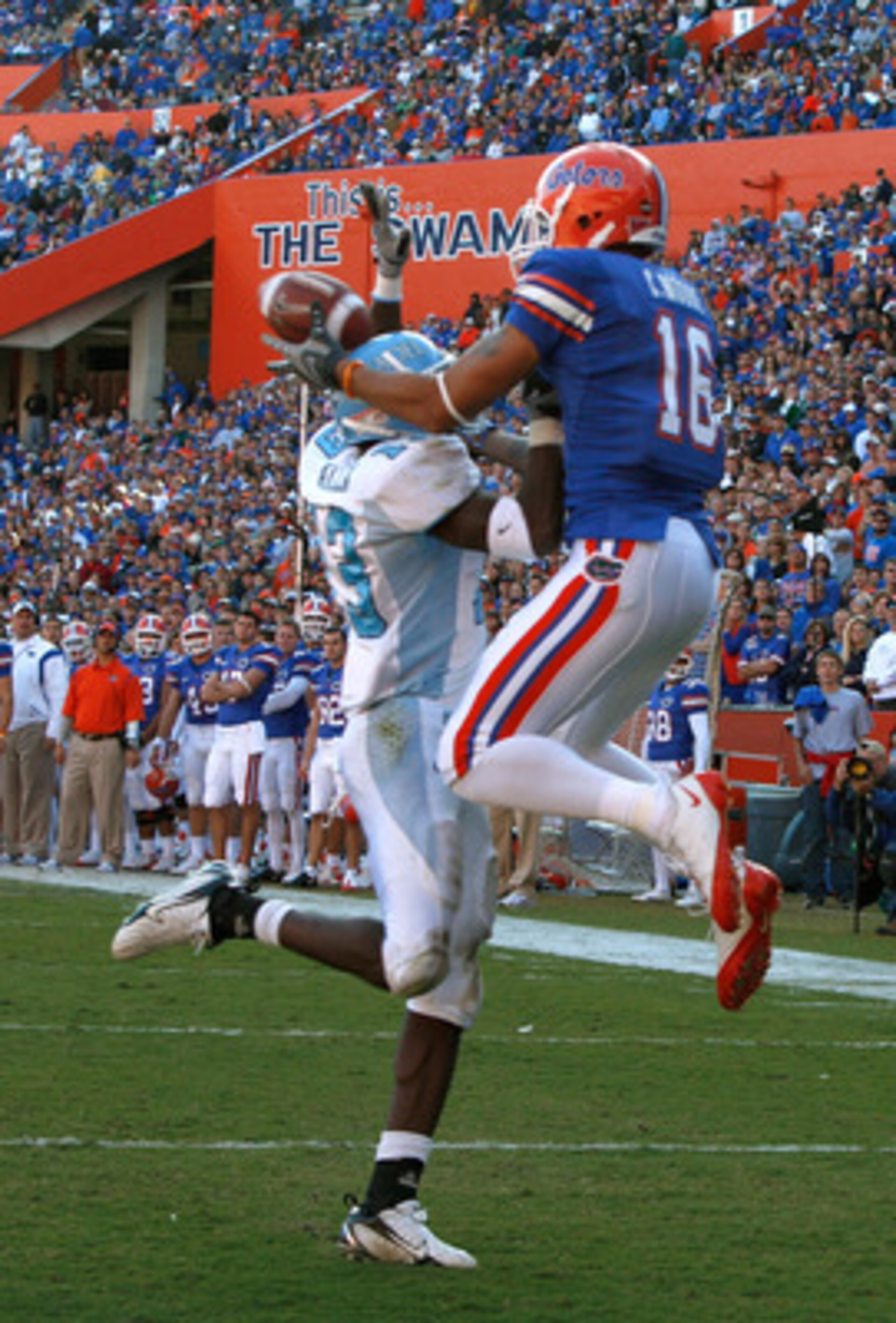 GAINESVILLE, FL - NOVEMBER 22:  Carl Moore #16 of the Florida Gators catches a pass against Cortez Allen #13 of the Citadel Bulldogs during the game at Ben Hill Griffin Stadium on November 22, 2008 in Gainesville, Florida.  (Photo by Sam Greenwood/Getty I