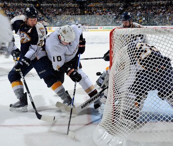 NASHVILLE, TN - APRIL 20:  Corey Perry #10 of the Anaheim Ducks fights Ryan Suter #20 of the Nashville Predators for a rebound in front of Predators goalie Pekka Rinne #35 in Game Four of the Western Conference Quarterfinals during the 2011 NHL Stanley Cu