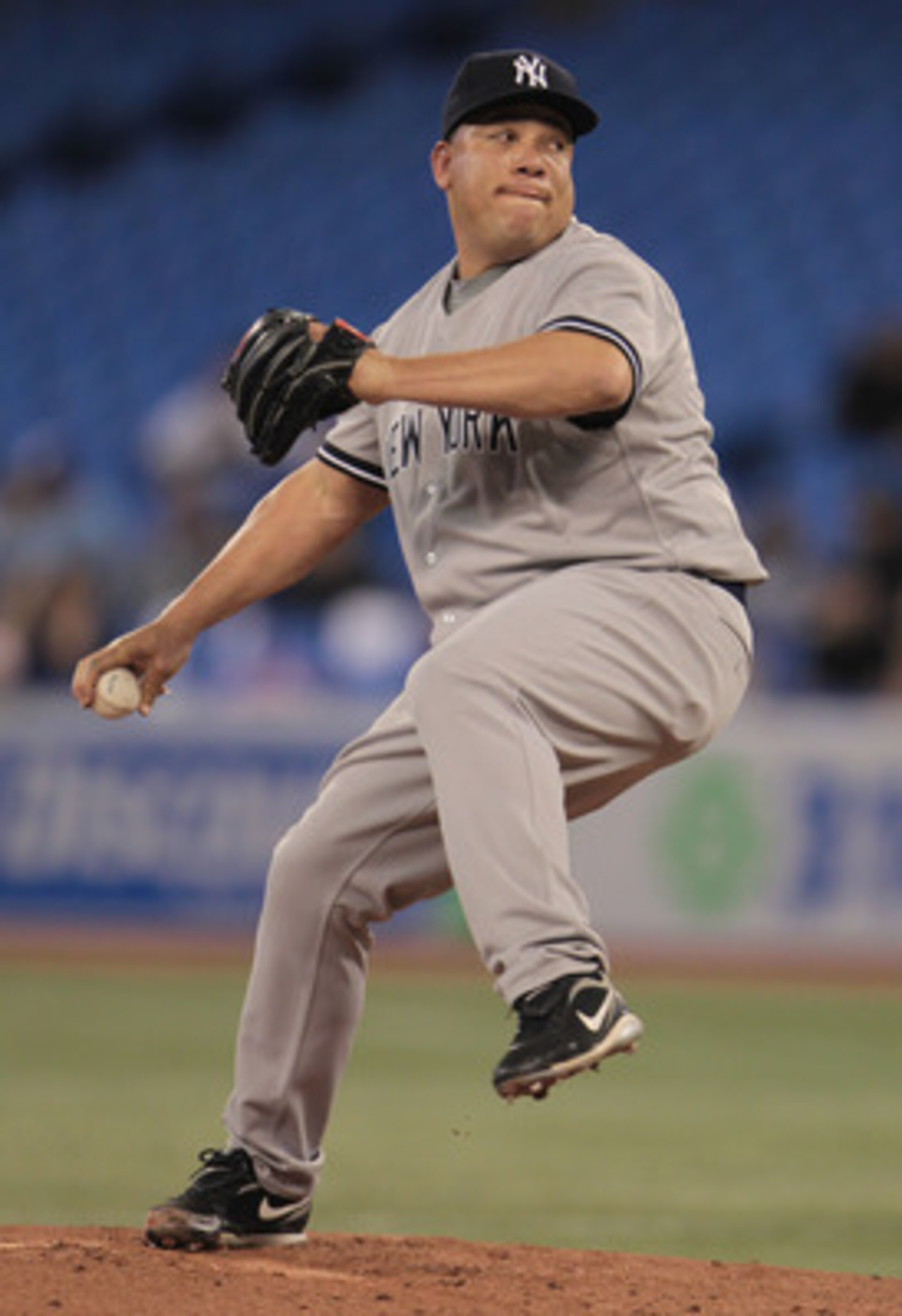 TORONTO, ON - APRIL 20:  Bartolo Colon #40 of the New York Yankees throws a pitch during their game against the Toronto Blue Jays at Rogers Centre on April 20, 2011 in Toronto, Canada.  (Photo by Scott Halleran/Getty Images)