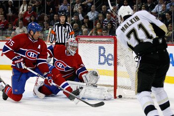 MONTREAL, CANADA - JANUARY 12:  Carey Price #31 and Hal Gill #75 of the Montreal Canadiens watch the puck hit the post on a shot by Evgeni Malkin #71 of the Pittsburgh Penguins during the NHL game at the Bell Centre on January 12, 2011 in Montreal, Quebec