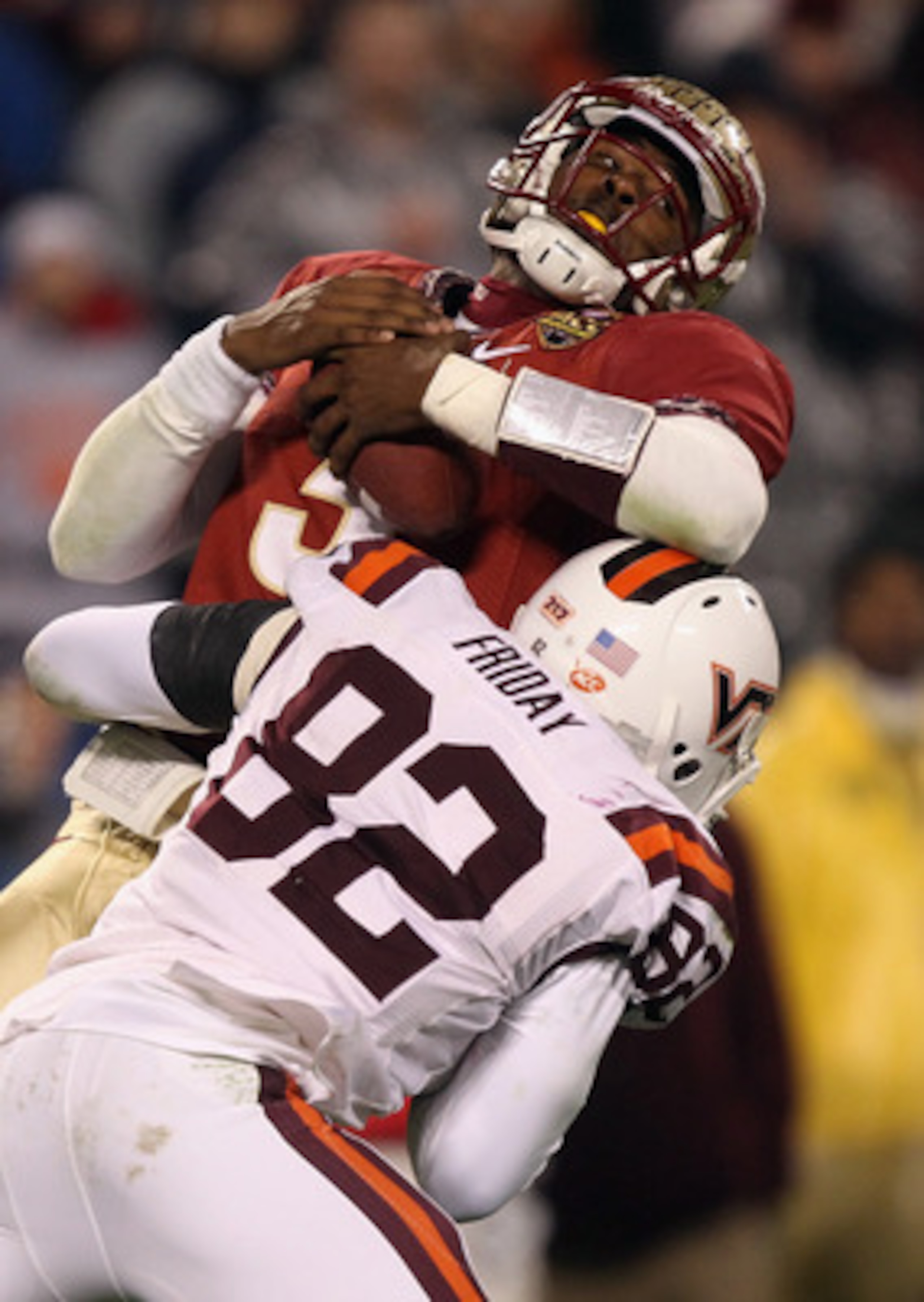CHARLOTTE, NC - DECEMBER 04:  EJ Manuel #3 of the Florida State Seminoles is sacked by Steven Friday #82 of the Virginia Tech Hokies during their game at Bank of America Stadium on December 4, 2010 in Charlotte, North Carolina.  (Photo by Streeter Lecka/G