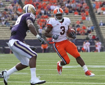 SEATTLE - SEPTEMBER 11:  Running back Delone Carter #3 of the Syracuse Orange rushes against Quinton Richardson #28 of the Washington Huskies on September 11, 2010 at Husky Stadium in Seattle, Washington. (Photo by Otto Greule Jr/Getty Images)