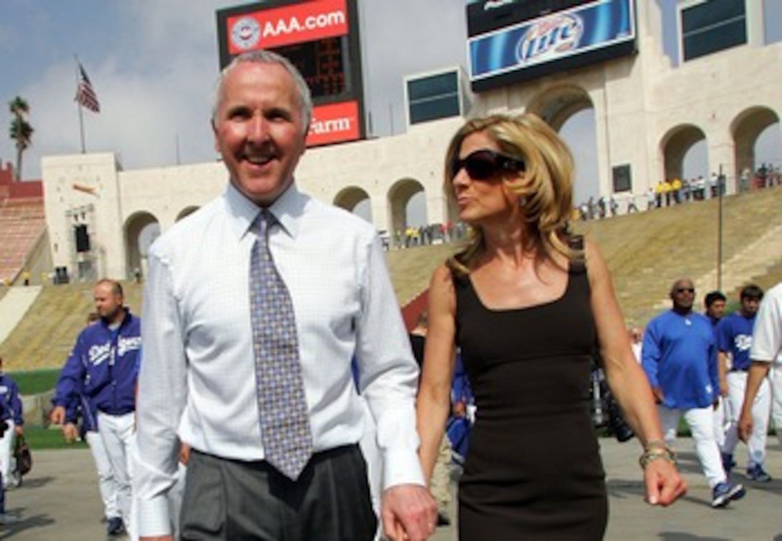 LOS ANGELES, CA - MARCH 29:  Los Angeles Dodgers owner Frank McCourt (L) and his wife Jamie walk into the Memorial Coliseum prior to the start of the game against the Boston Red Sox March 29, 2008 in Los Angeles, California.  (Photo by Jeff Gross/Getty Im