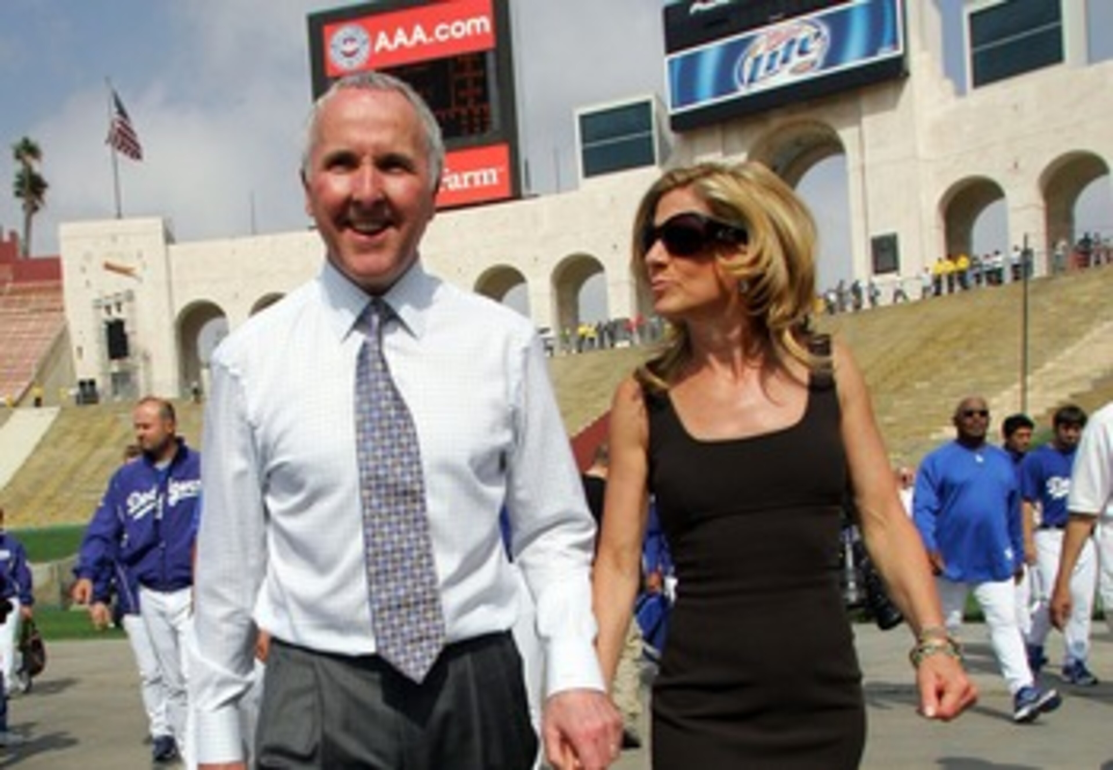 LOS ANGELES, CA - MARCH 29: Los Angeles Dodgers owner Frank McCourt (L) and his wife Jamie walk into the Memorial Coliseum prior to the start of the game against the Boston Red Sox March 29, 2008 in Los Angeles, California. (Photo by Jeff Gross/Getty Im LOS ANGELES, CA - MARCH 29: Los Angeles Dodgers owner Frank McCourt (L) and his wife Jamie walk into the Memorial Coliseum prior to the start of the game against the Boston Red Sox March 29, 2008 in Los Angeles, California. (Photo by Jeff Gross/Getty Im