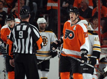 PHILADELPHIA, PA - APRIL 30: Chris Pronger #20 of the Philadelphia Flyers argues a call with referee Dan O'Rourke #9 in Game One against the Boston Bruins  of the Eastern Conference Semifinals during the 2011 NHL Stanley Cup Playoffs at the Wells Fargo Ce