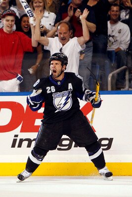 TAMPA, FL - APRIL 20: Martin St. Louis #26 of the Tampa Bay Lightning celebrates a goal against the Pittsburgh Penguins in Game Four of the Eastern Conference Quarterfinals during the 2011 NHL Stanley Cup Playoffs at the St. Pete Times Forum on April 20, 