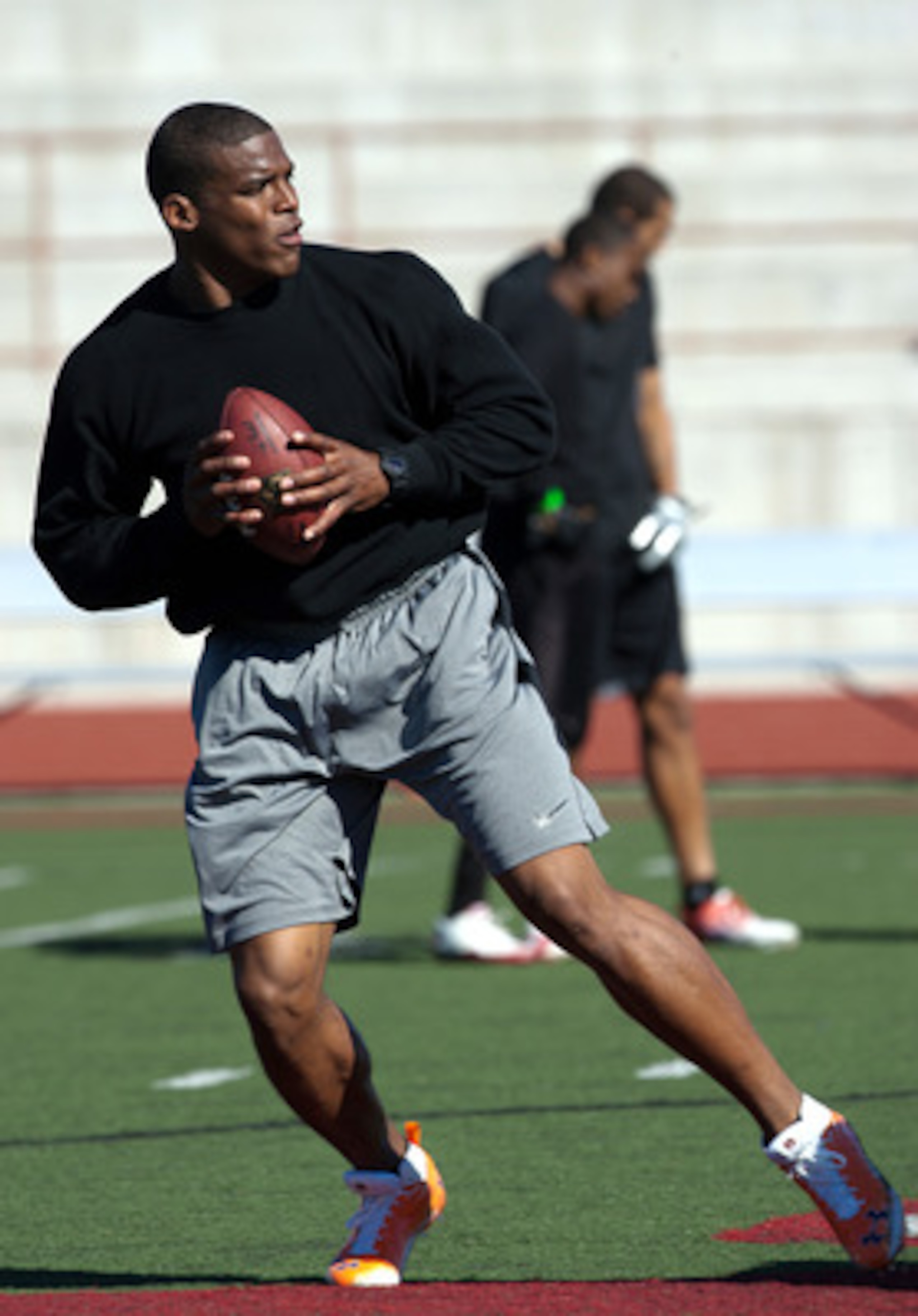 SAN DIEGO, CA - FEBRUARY 10:  2010 Heisman Trophy winning quarterback Cam Newton of the Auburn Tigers goes through his workout routine for the media at Cathedral High School's sports stadium on February 10, 2011 in San Diego, California.  (Photo by Kent H