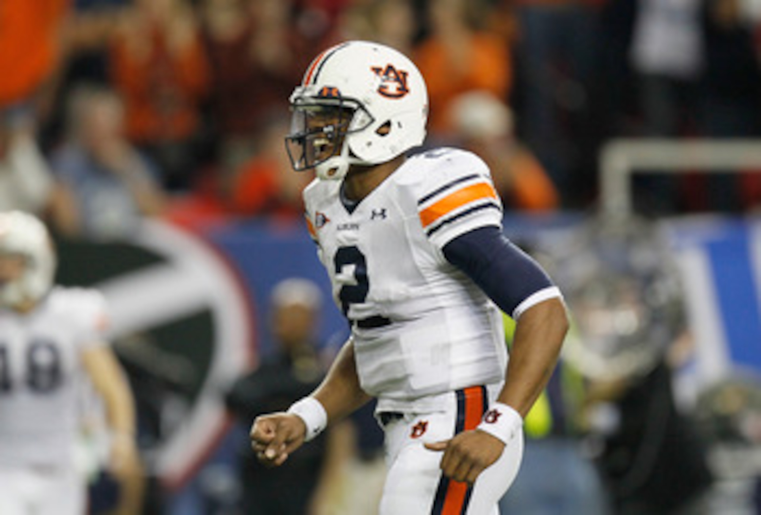 ATLANTA, GA - DECEMBER 04:  Quarterback Cam Newton #2 of the Auburn Tigers reacts after tossing a touchdown pass against the South Carolina Gamecocks during the 2010 SEC Championship at Georgia Dome on December 4, 2010 in Atlanta, Georgia.  (Photo by Kevi