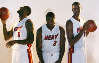 MIAMI - SEPTEMBER 27:  (L-R) LeBron James, Dwyane Wade and Chris Bosh of the Miami Heat pose for photos during media day at the Bank United Center on September 27, 2010 in Miami, Florida.  (Photo by Marc Serota/Getty Images)