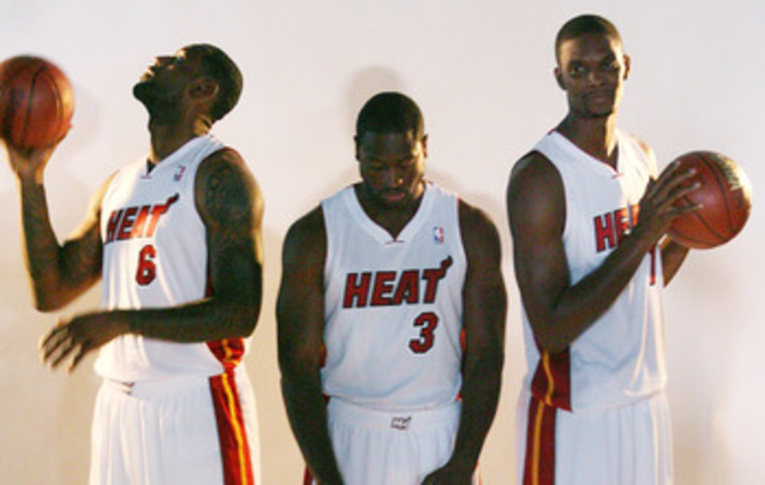 MIAMI - SEPTEMBER 27:  (L-R) LeBron James, Dwyane Wade and Chris Bosh of the Miami Heat pose for photos during media day at the Bank United Center on September 27, 2010 in Miami, Florida.  (Photo by Marc Serota/Getty Images)