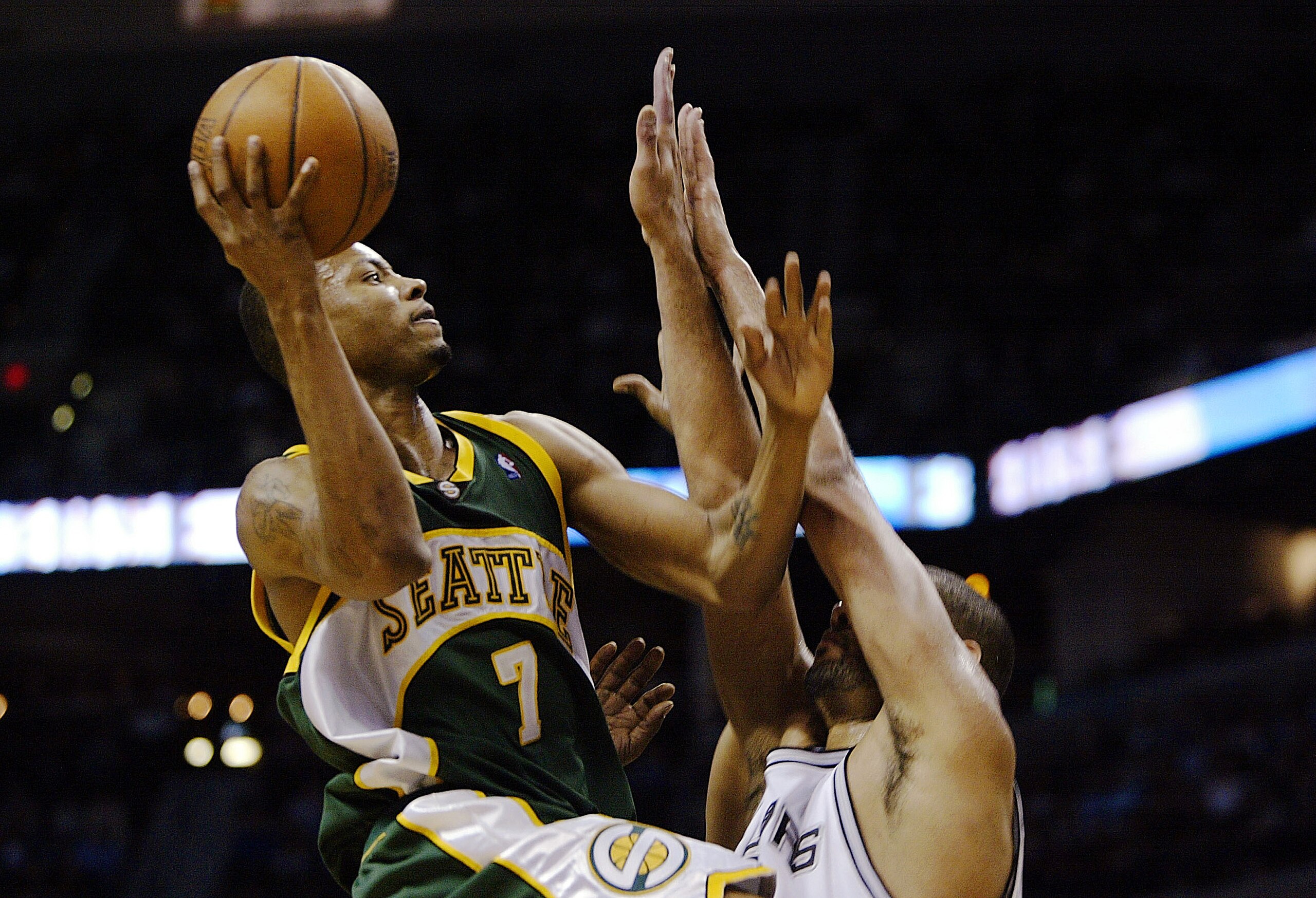 SAN ANTONIO - MAY 8: Rashard Lewis #7 of the Seattle SuperSonics takes the ball up against Tim Duncan #21 of the San Antonio Spurs during the fourth quarter in Game one of the Western Conference Semifinals during the 2005 NBA Playoffs at the SBC Center o SAN ANTONIO - MAY 8: Rashard Lewis #7 of the Seattle SuperSonics takes the ball up against Tim Duncan #21 of the San Antonio Spurs during the fourth quarter in Game one of the Western Conference Semifinals during the 2005 NBA Playoffs at the SBC Center o