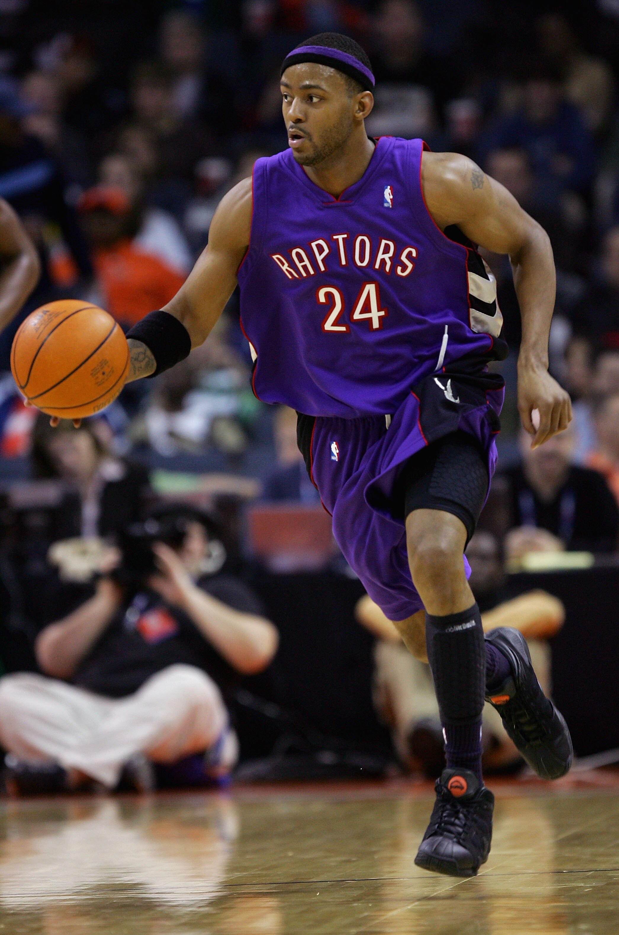 CHARLOTTE, NC - DECEMBER 10:  Morris Peterson #24 of the Toronto Raptors brings the ball upcourt during the game against the Charlotte Bobcats on December 10, 2005 at the Charlotte Bobcats Arena in Charlotte, North Carolina.  The Raptors won 111-103.  NOT